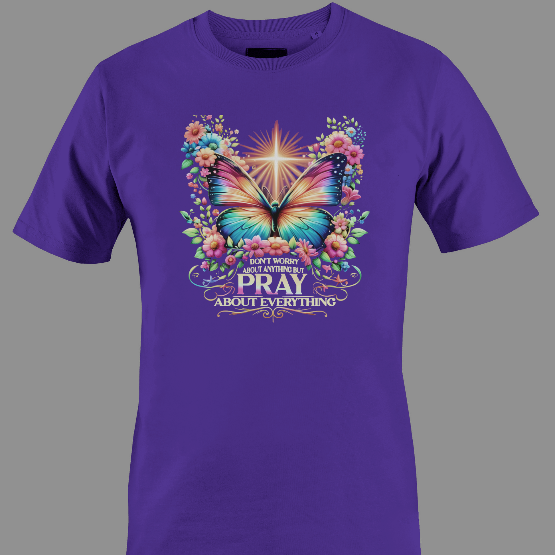 Dark purple  t-shirt with a colorful butterfly and florals with text Pray 