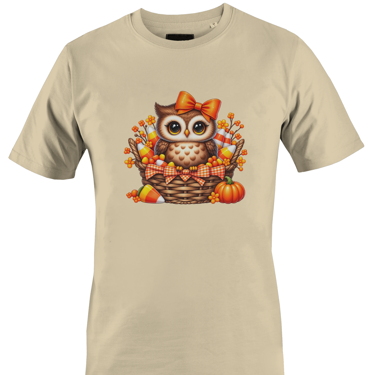 Tan t-shirt by Monkey's Creations featuring an owl in a basket with pumpkins and candy corn.