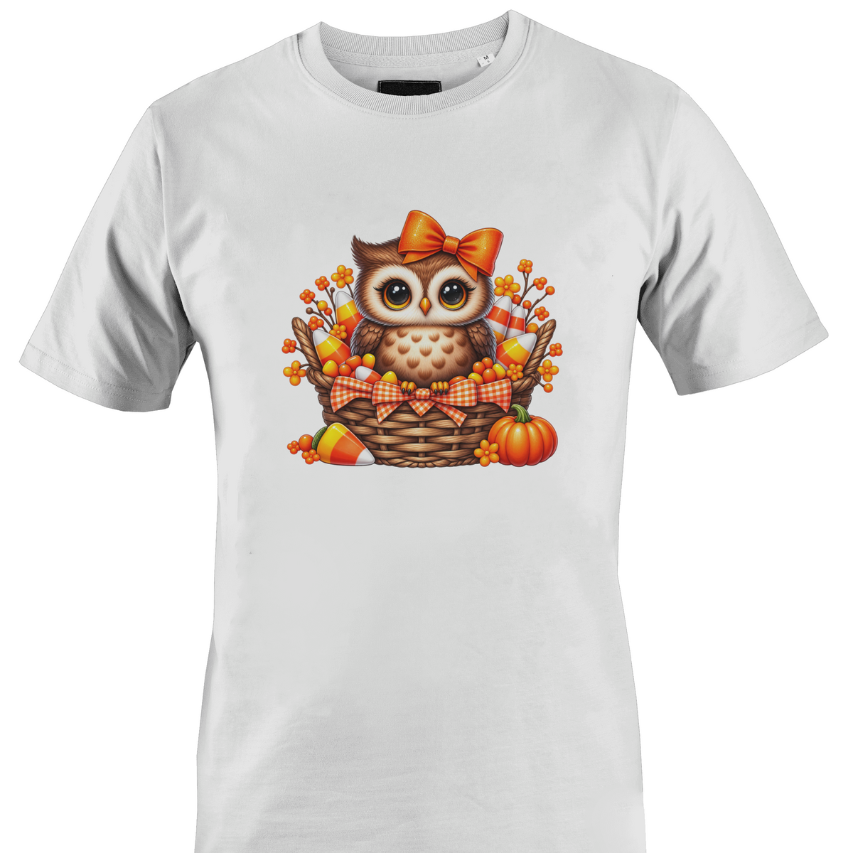 White t-shirt by Monkey's Creations featuring an owl in a basket with pumpkins and candy corn.