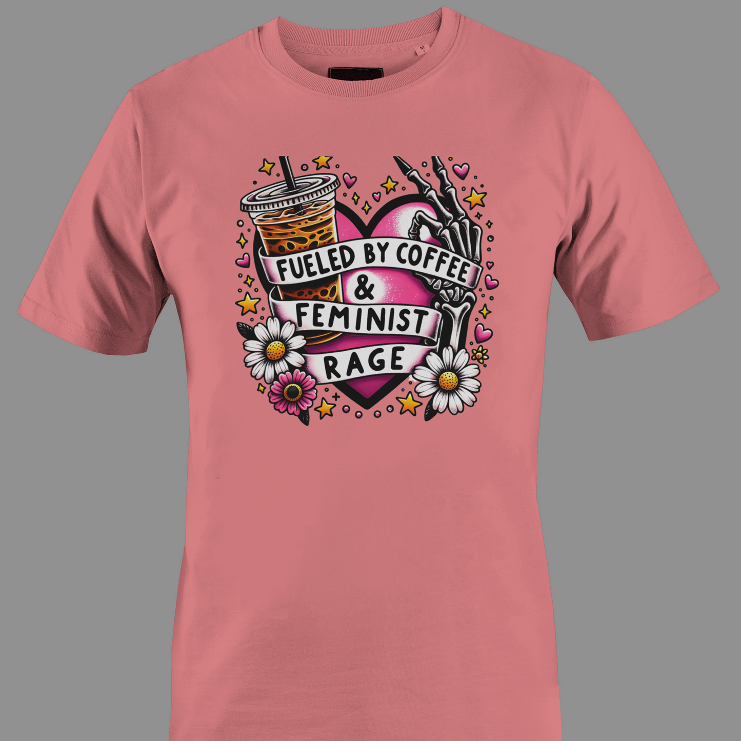 Coral t-shirt with Iced coffee, flowers, and a hand holding a pen, with text 'Fueled by Coffee & Feminist Rage'.
