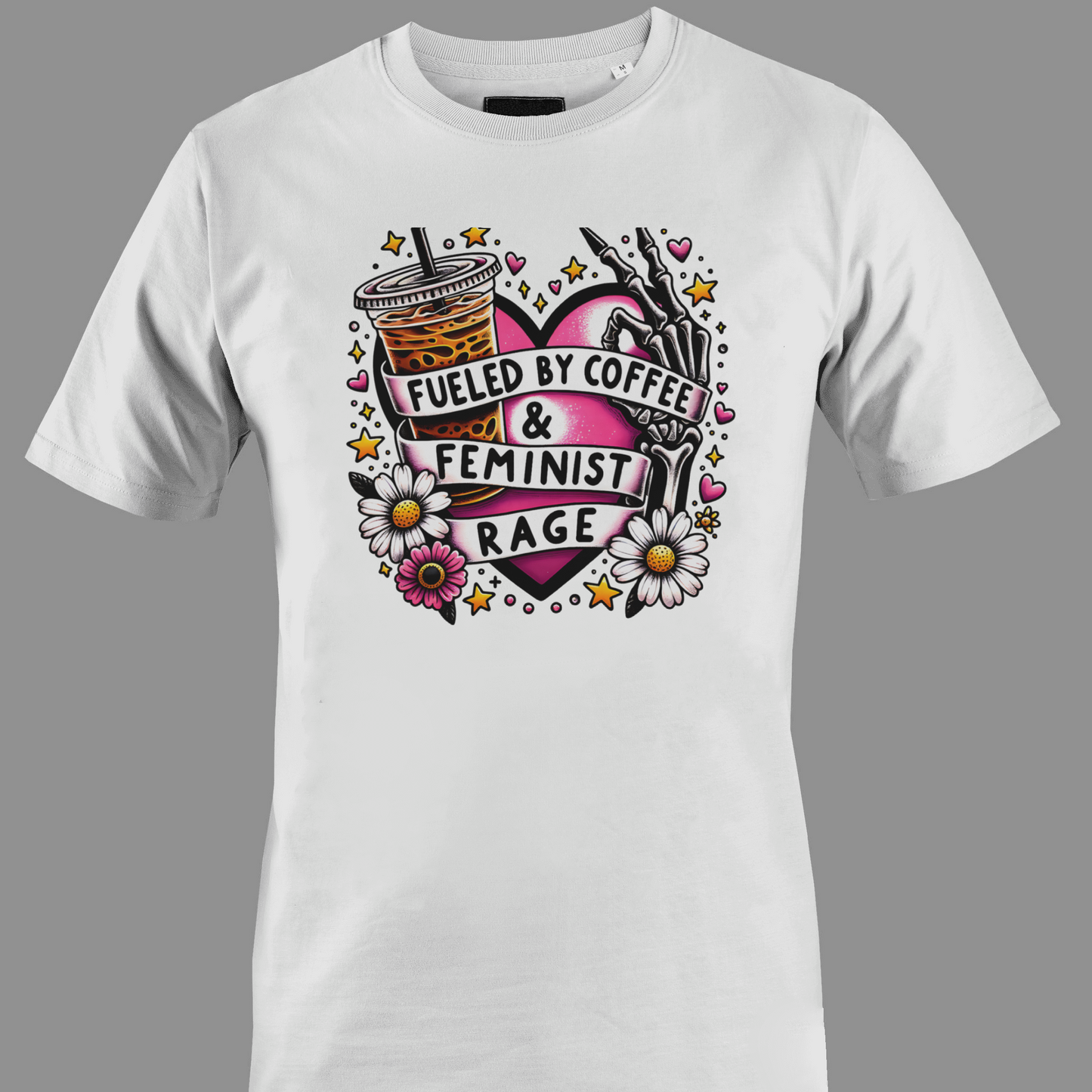 White t-shirt with Iced coffee, flowers, and a hand holding a pen, with text 'Fueled by Coffee & Feminist Rage'.