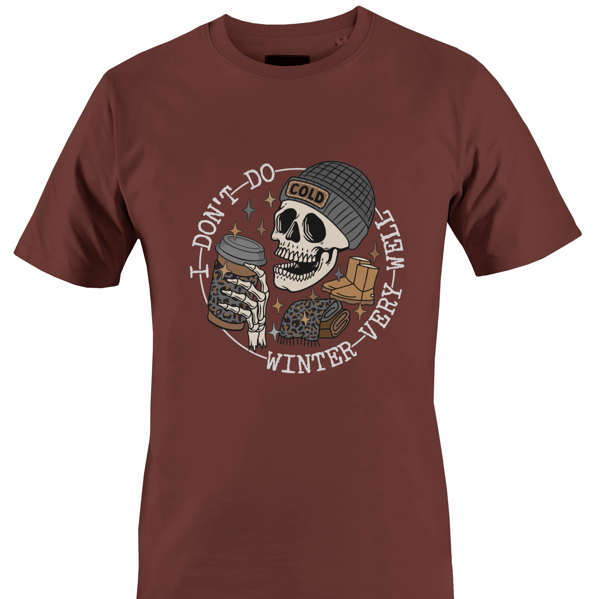 Brown t-shirt with a skeleton wearing a hat, ugg boots, a scarf and a coffee and the text "I don't do winter very well" by Monkey's Creations. 