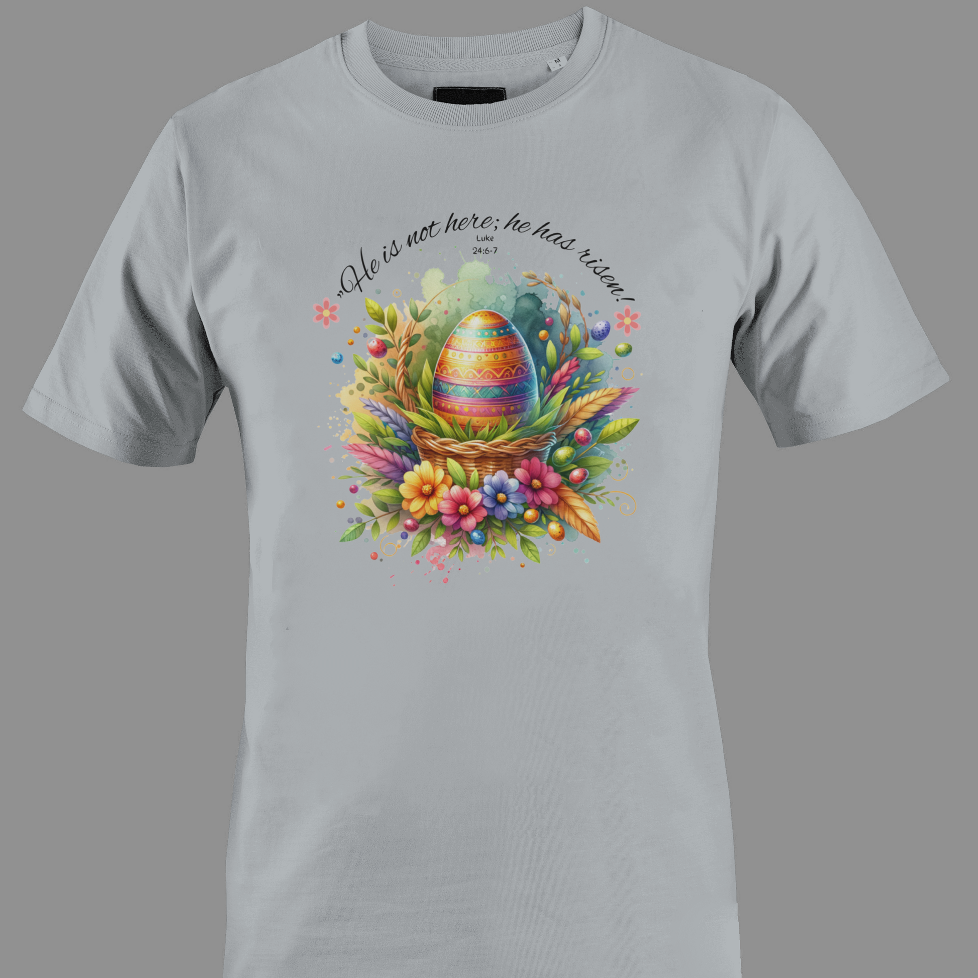 Light gray t-shirt with Easter egg in a basket with flowers and leaves, featuring a religious quote.