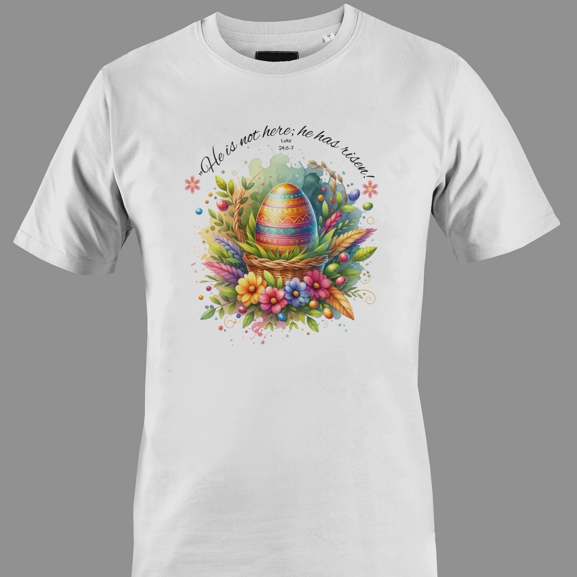 White t-shirt with Easter egg in a basket with flowers and leaves, featuring a religious quote.