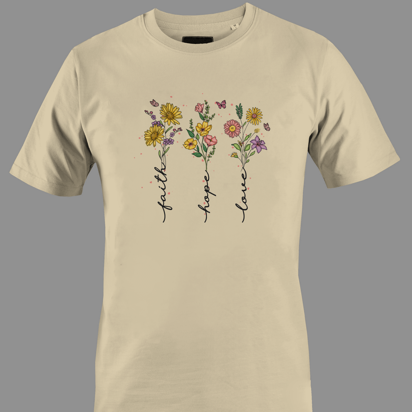 Beige t-shirt with flowers with stem text 'faith', 'hope', and 'love' 