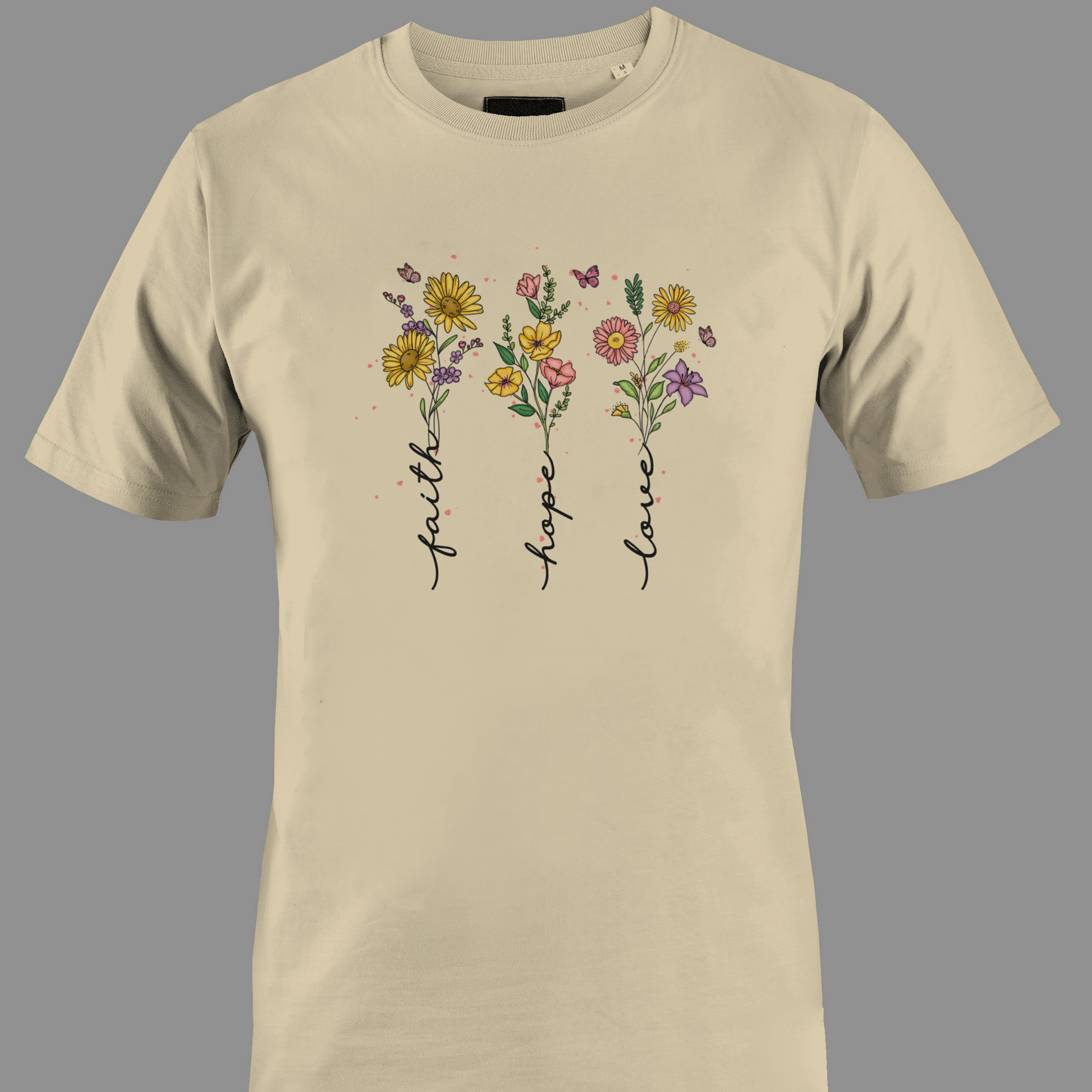 Beige t-shirt with flowers with stem text 'faith', 'hope', and 'love' 