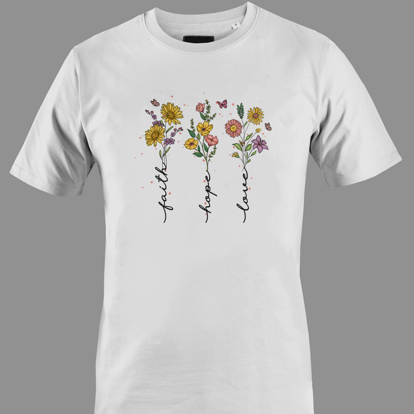 White t-shirt with flowers with stem text 'faith', 'hope', and 'love' 
