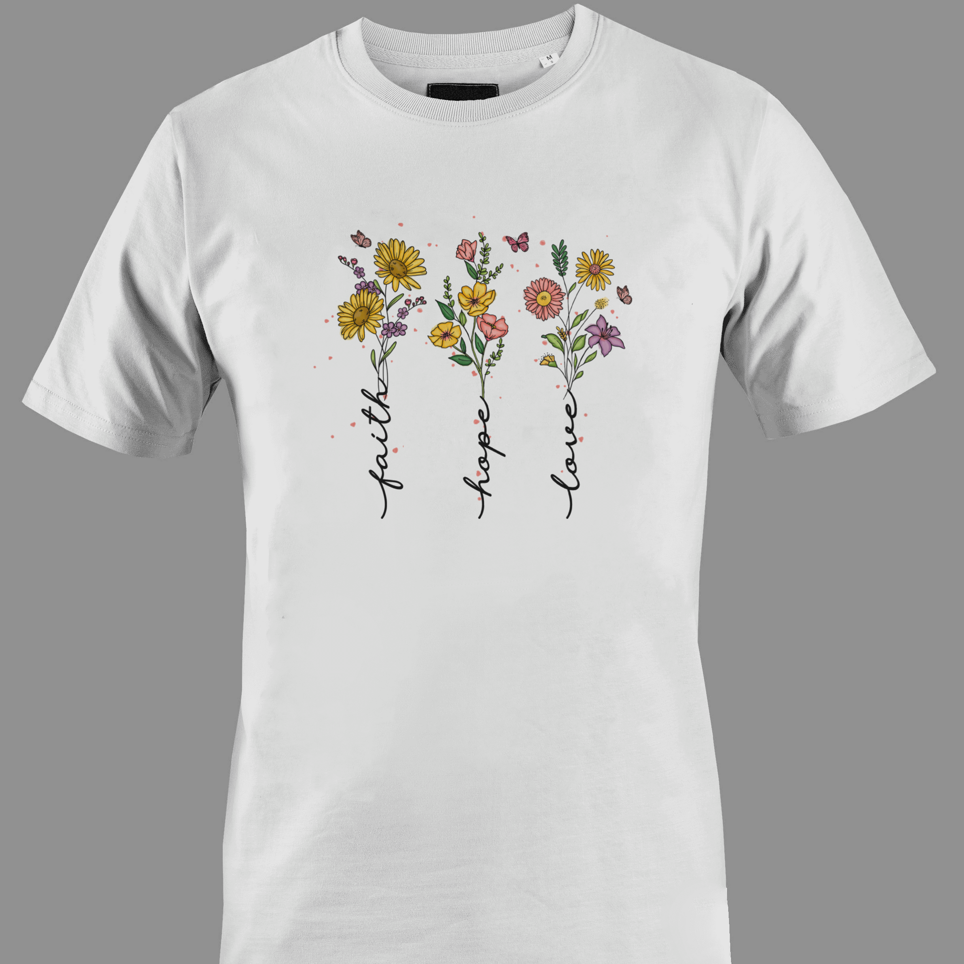 White t-shirt with flowers with stem text 'faith', 'hope', and 'love' 
