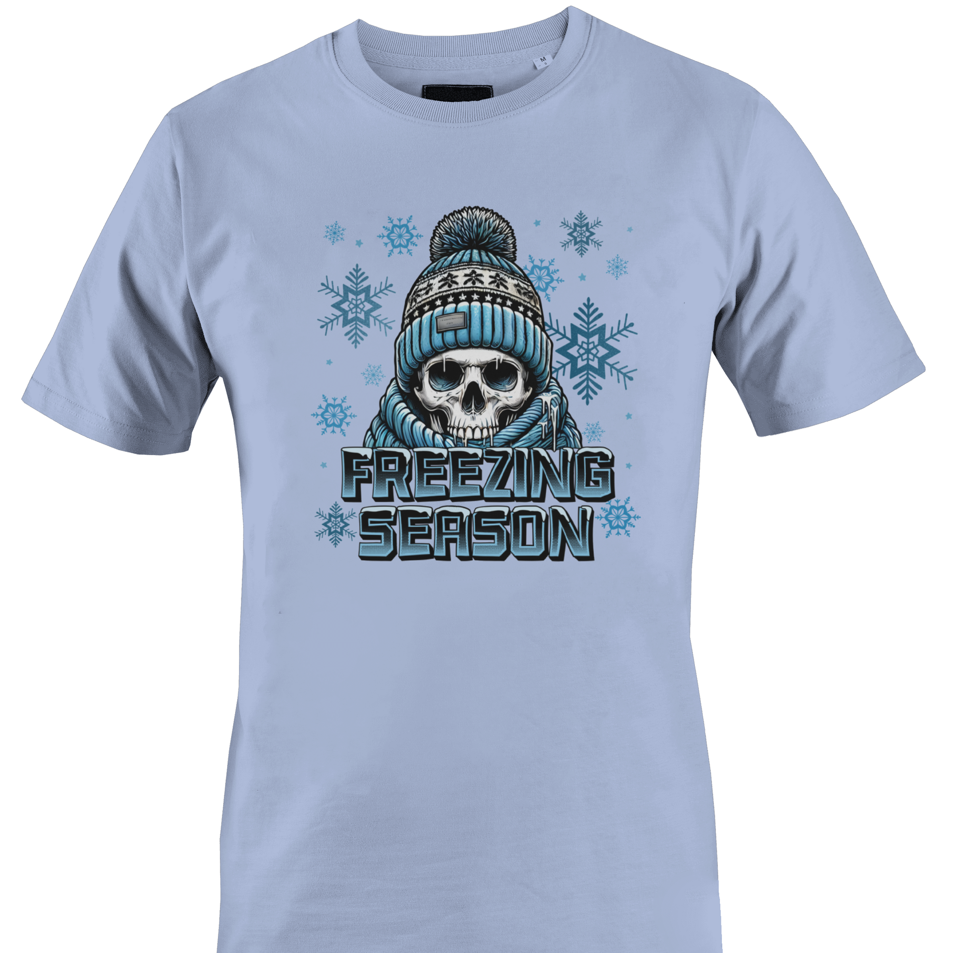 Light blue t-shirt with a skull wearing a hat and scarf and the text "freezing season" by Monkey's Creations.