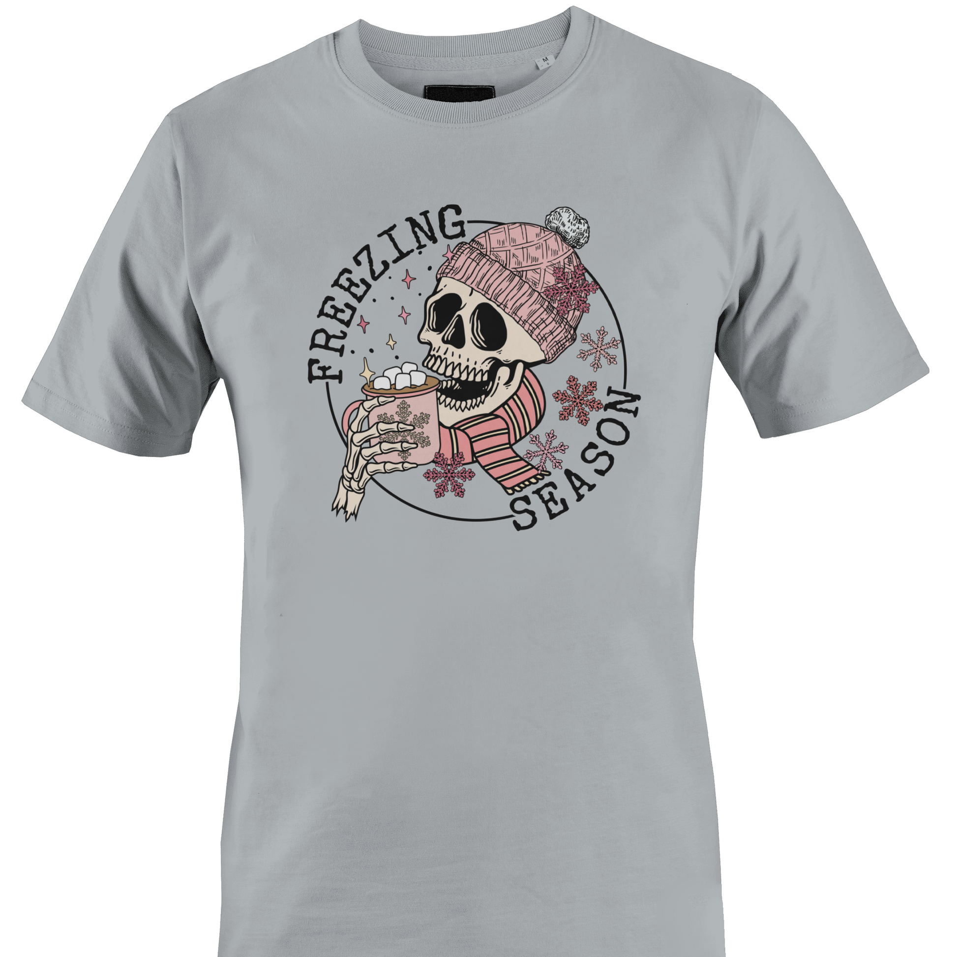 Light grey t-shirt with a skull wearing a hat and scarf with a hot chocolate and the text "freezing season" by Monkey's Creations.