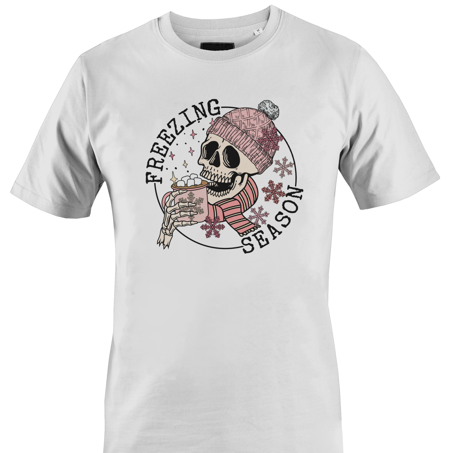 White t-shirt with a skull wearing a hat and scarf with a hot chocolate and the text "freezing season" by Monkey's Creations.
