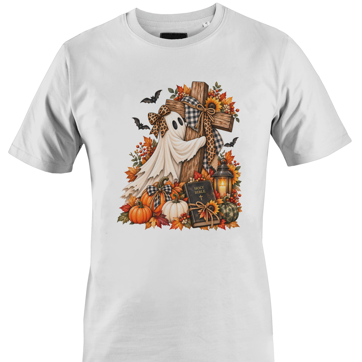 A white crewneck t-shirt featuring a detailed autumn Halloween graphic with a white ghost draped over a wooden cross, surrounded by pumpkins, fall leaves, sunflowers, a lantern, and bats by Monkey's Creations.