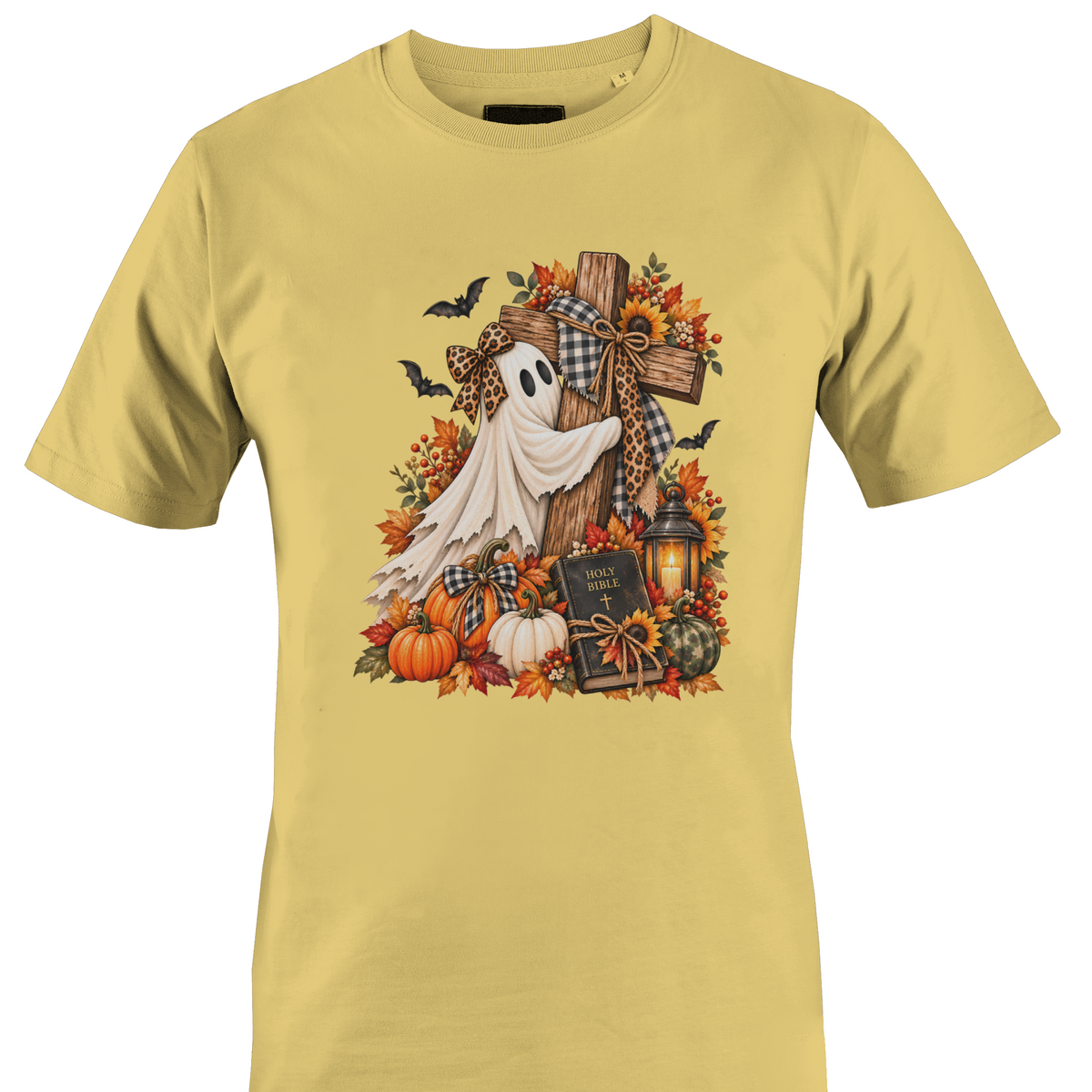 A yellow crewneck t-shirt featuring a detailed autumn Halloween graphic with a white ghost draped over a wooden cross, surrounded by pumpkins, fall leaves, sunflowers, a lantern, and bats by Monkey's Creations.