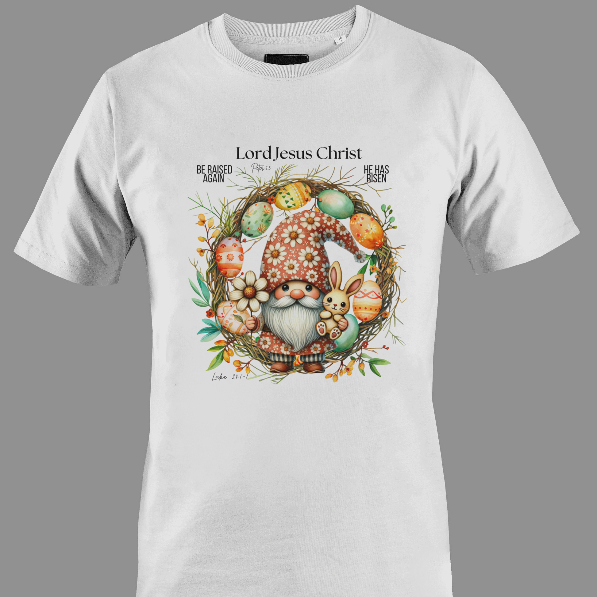 White t-shirt with an Easter gnome with a bunny, and Easter eggs surrounded by a wreath.