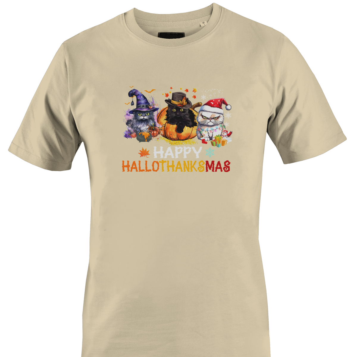 A beige crewneck t-shirt featuring a colorful graphic of three cartoon cats with pumpkins and the text 'HAPPY HALLOTHANKSMAS' printed on the chest by Monkey's Creation.