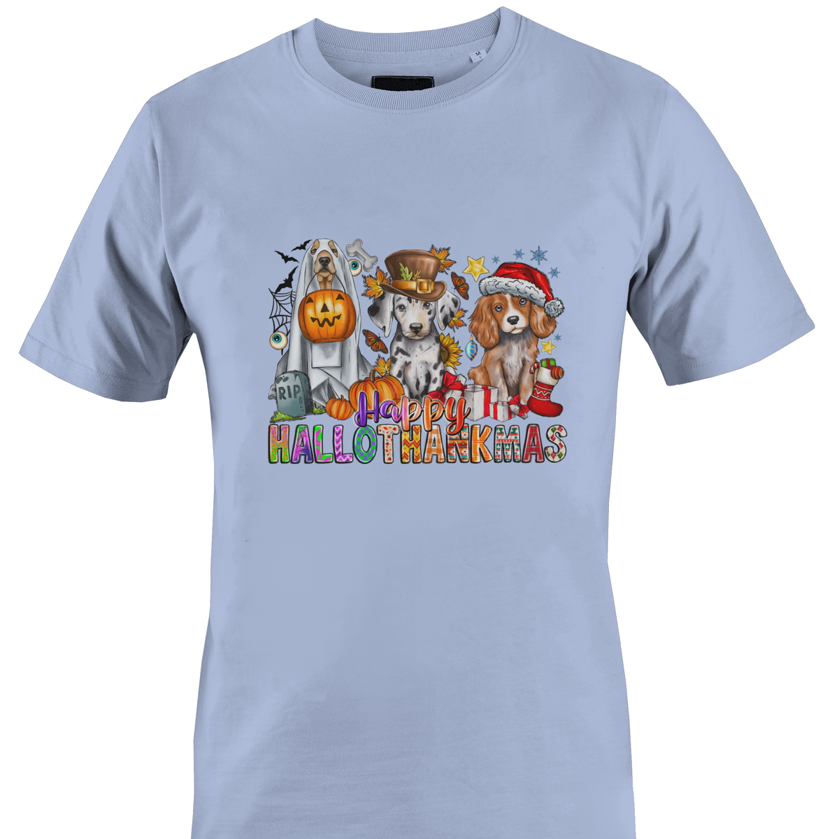 A light blue crewneck t-shirt featuring a colorful graphic print of three dogs dressed in Halloween costumes with the text 'Happy HALLOTHANKSMAS'.