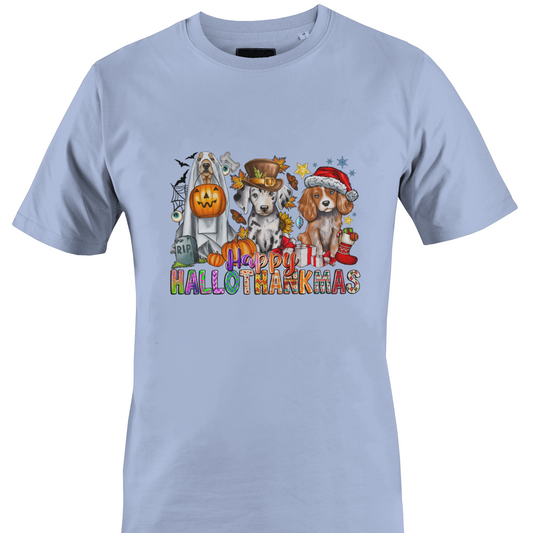 A light blue crewneck t-shirt featuring a colorful graphic print of three dogs dressed in Halloween costumes with the text 'Happy HALLOTHANKSMAS'.