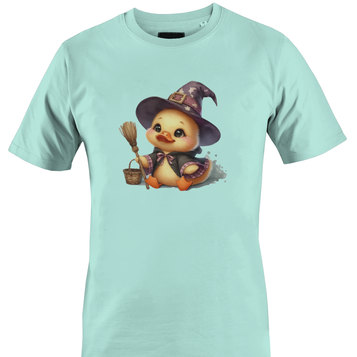 A mint green short-sleeve crewneck t-shirt featuring a cartoon graphic of a cute yellow duckling dressed as a witch in a pointed hat, holding a broom and a basket by Monkey's Creations.