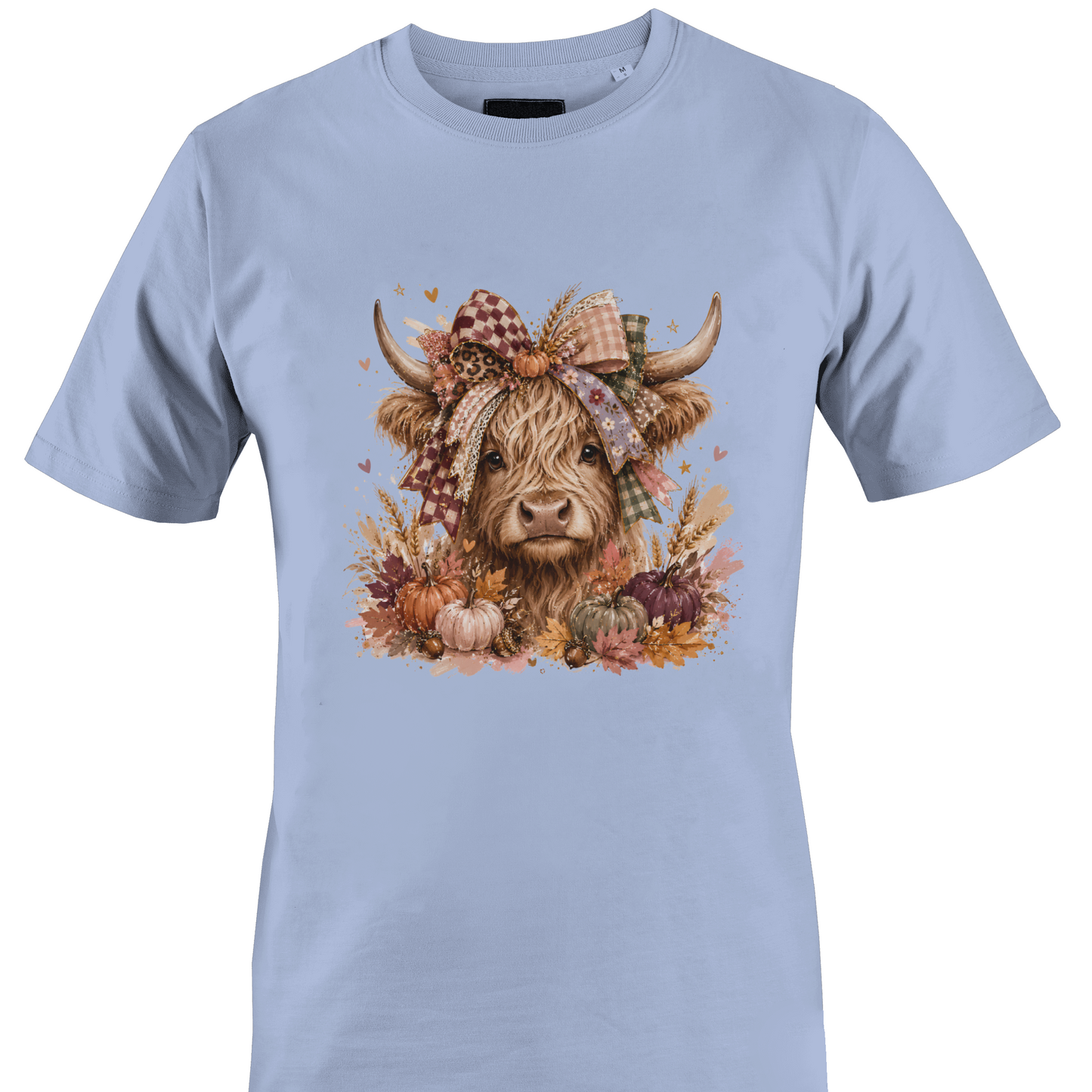 Light blue t-shirt with a highland cow wearing a farmhouse style bow with pumpkins and fall foliage by Monkey's Creations. 