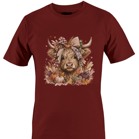 Maroon t-shirt with a highland cow wearing a farmhouse style bow with pumpkins and fall foliage by Monkey's Creations. 