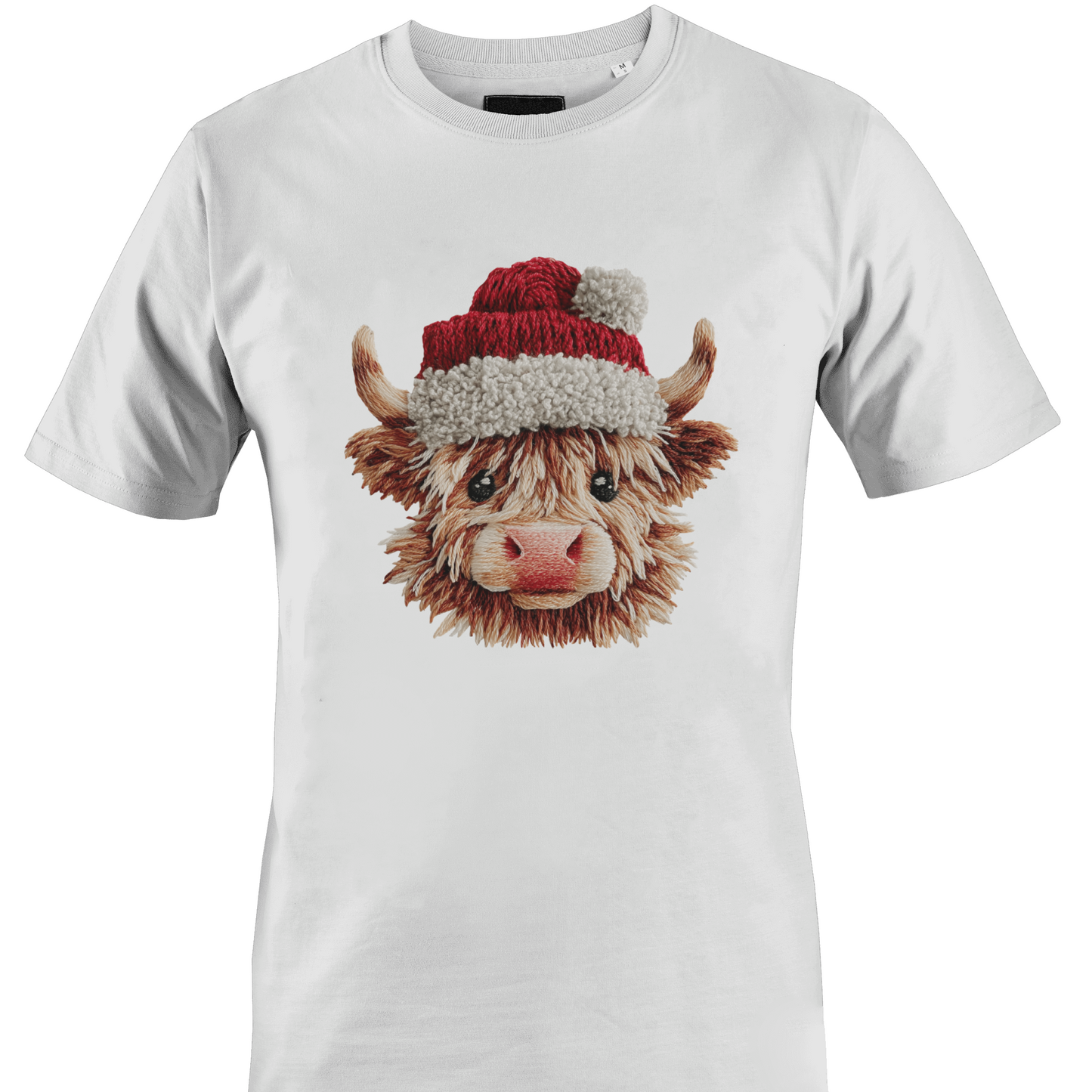 White t-shirt with a highland cow wearing a yarn Santa hat by Monkey's Creations. 