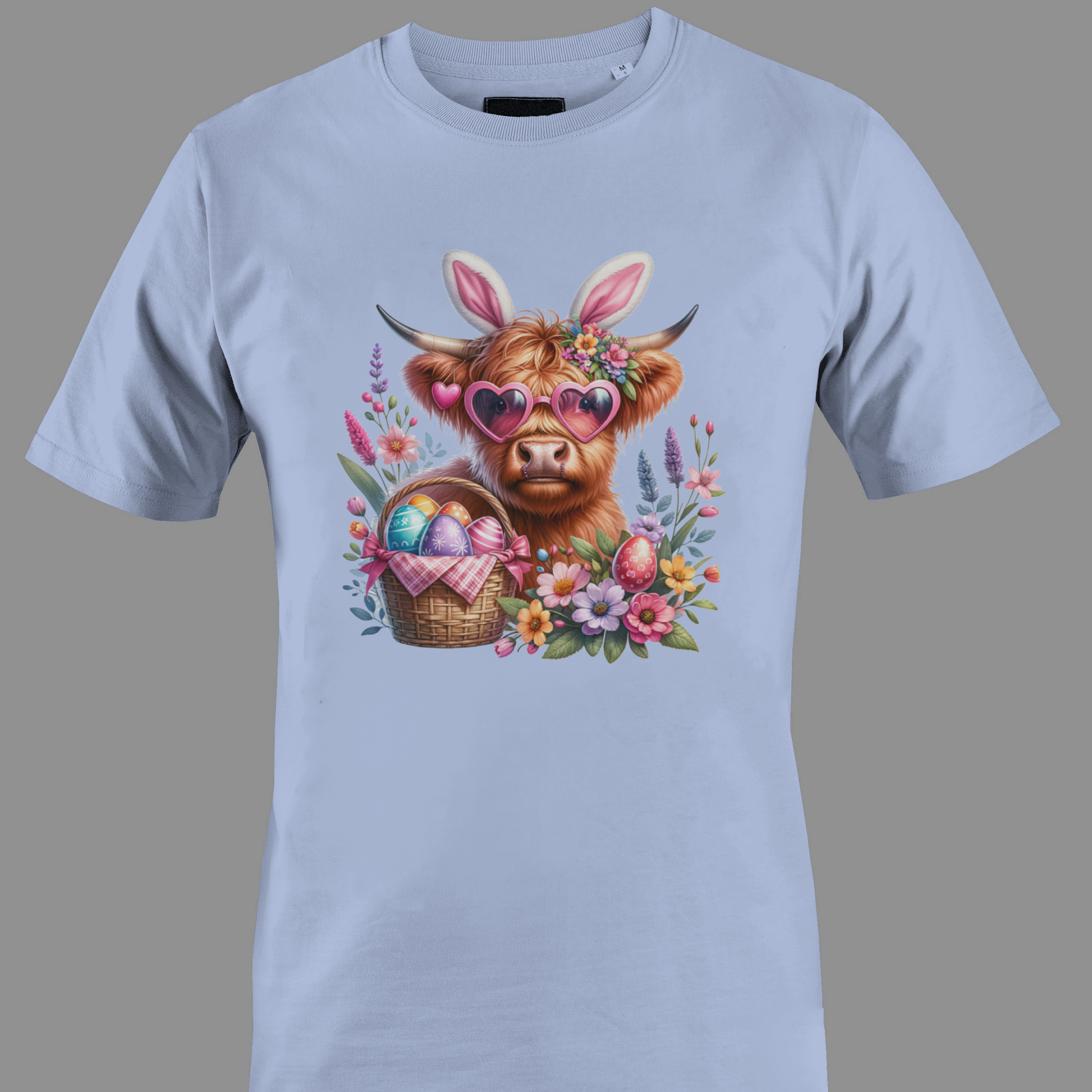 Light purple t-shirt with a highland cow wearing heart glasses with an easter egg basket and flowers