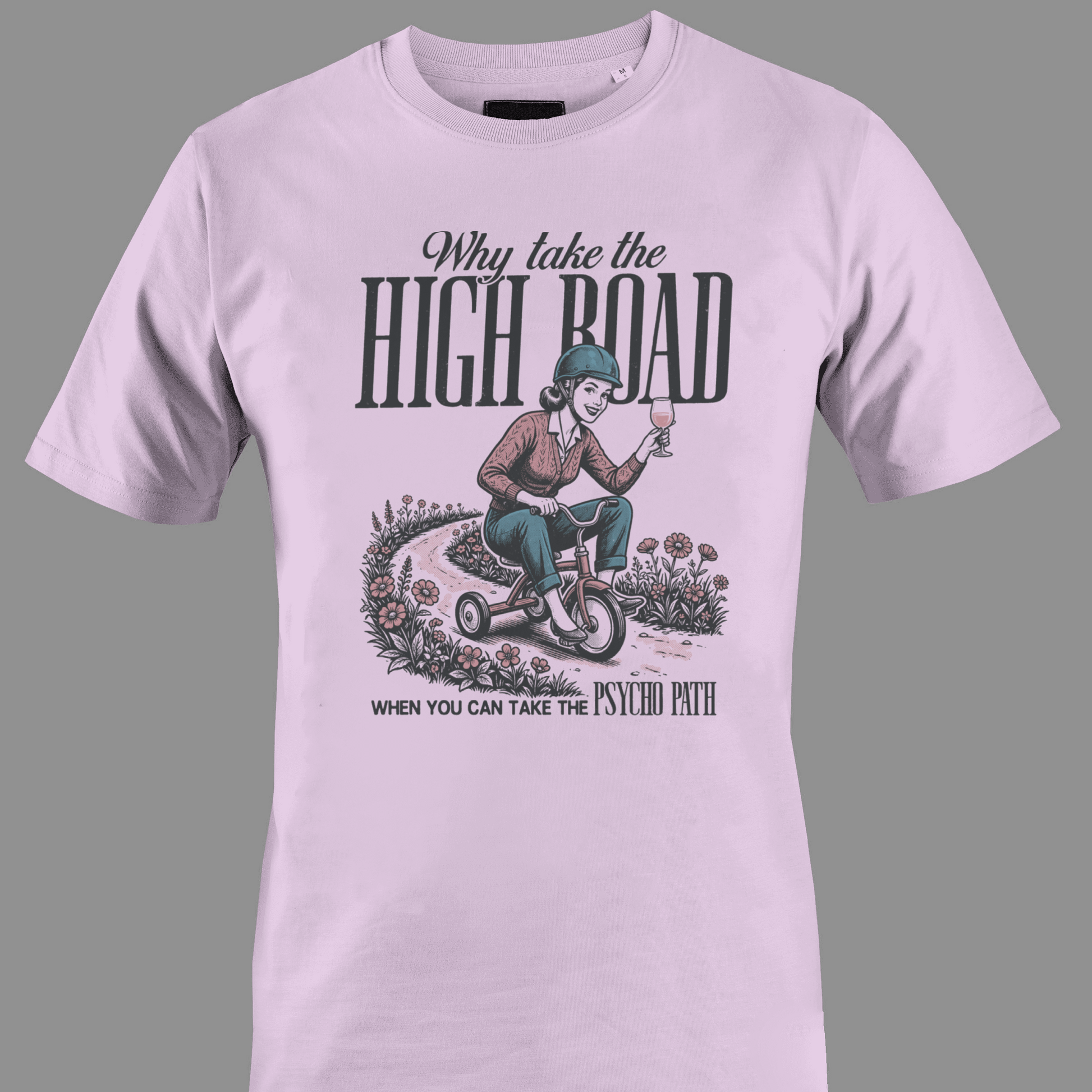 Light pink t-shirt with Lady on tricycle and text high road and psycho path
