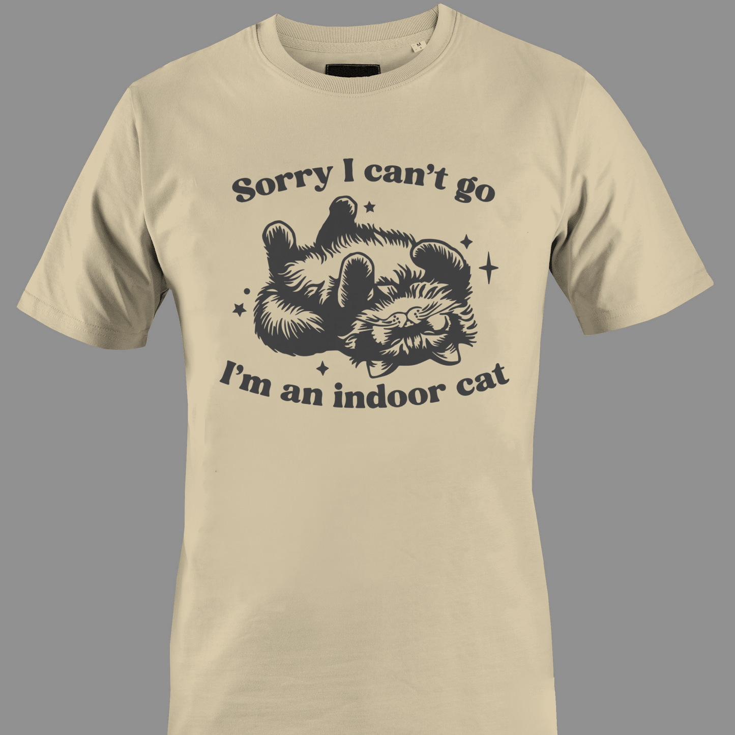 Beige t-shirt with sleeping cat illustration with text 'Sorry I can't go, I'm an indoor cat' 