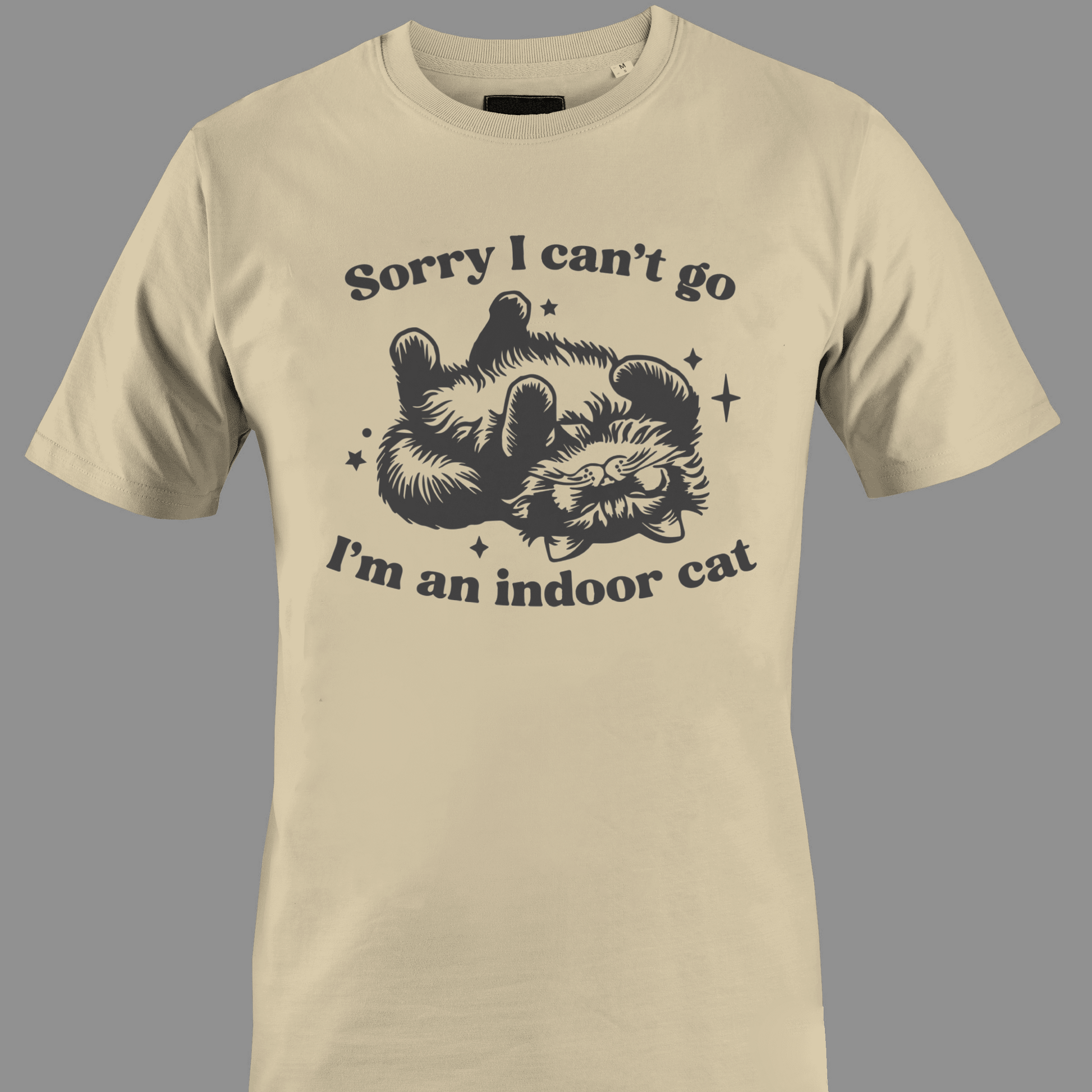 Beige t-shirt with sleeping cat illustration with text 'Sorry I can't go, I'm an indoor cat' 