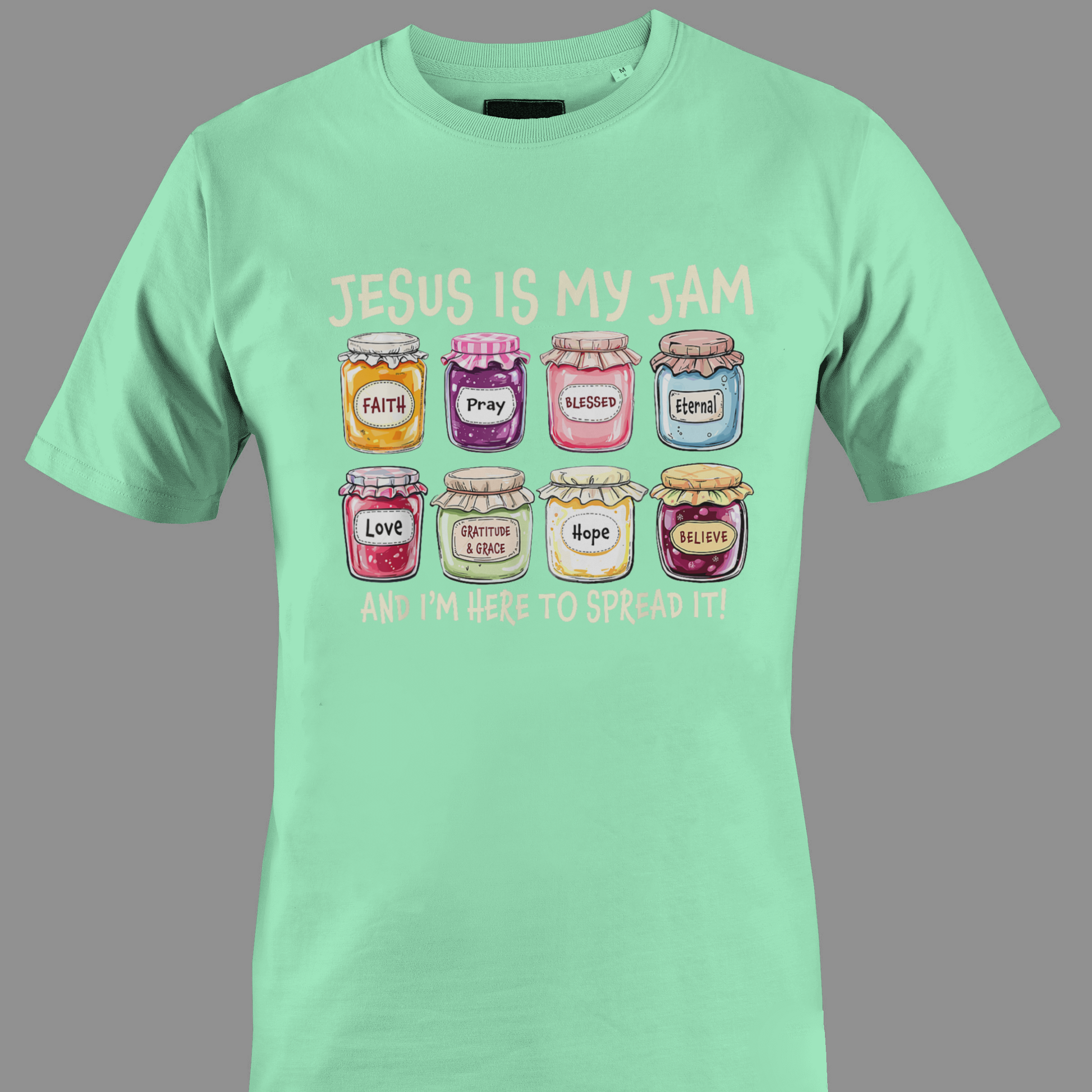 Light green t-shirt with colorful jam jars graphic and text Jesus is my jam