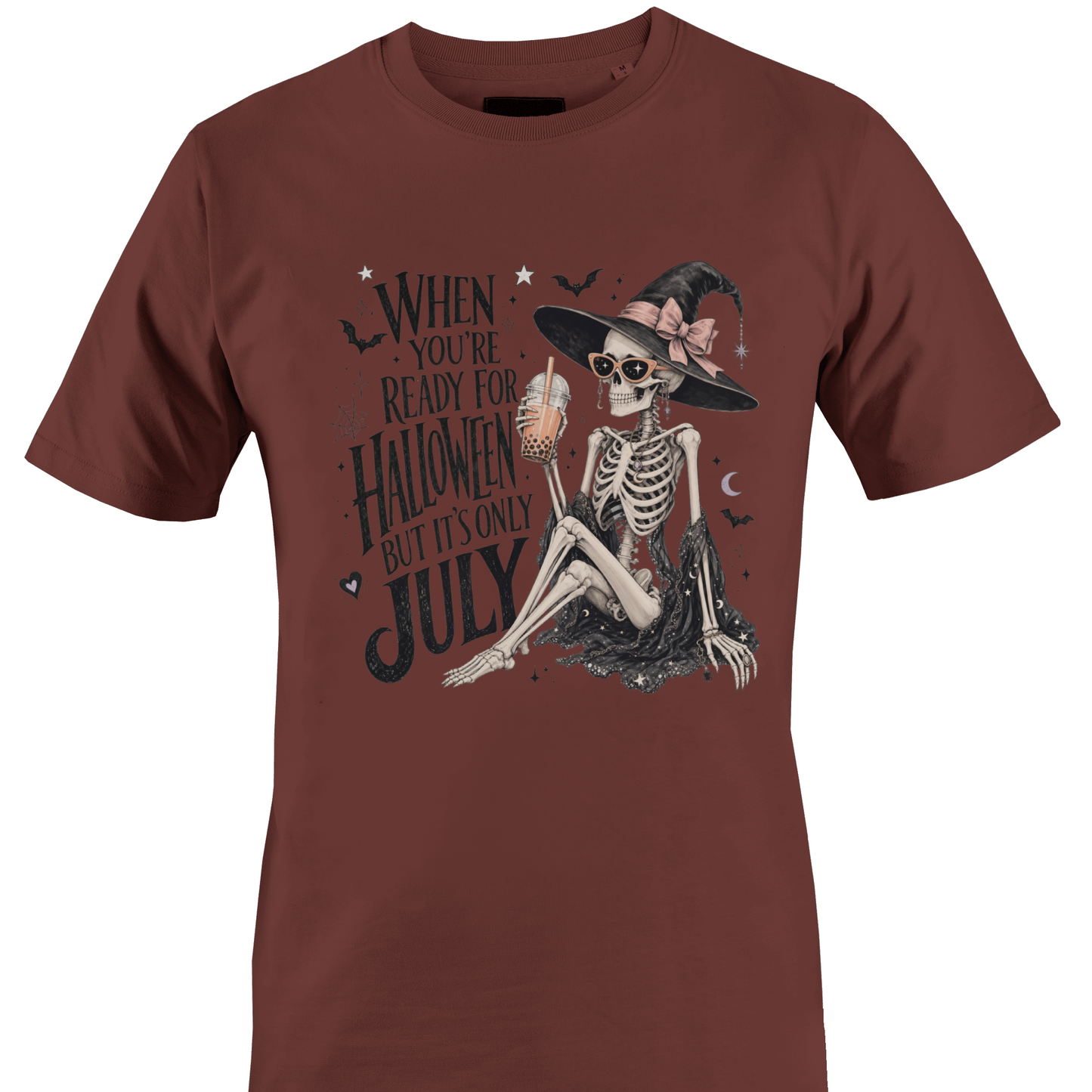 Brown t-shirt with skeleton witch design and text "when you're ready for Halloween but it's only July" by Monkey's Creations. 