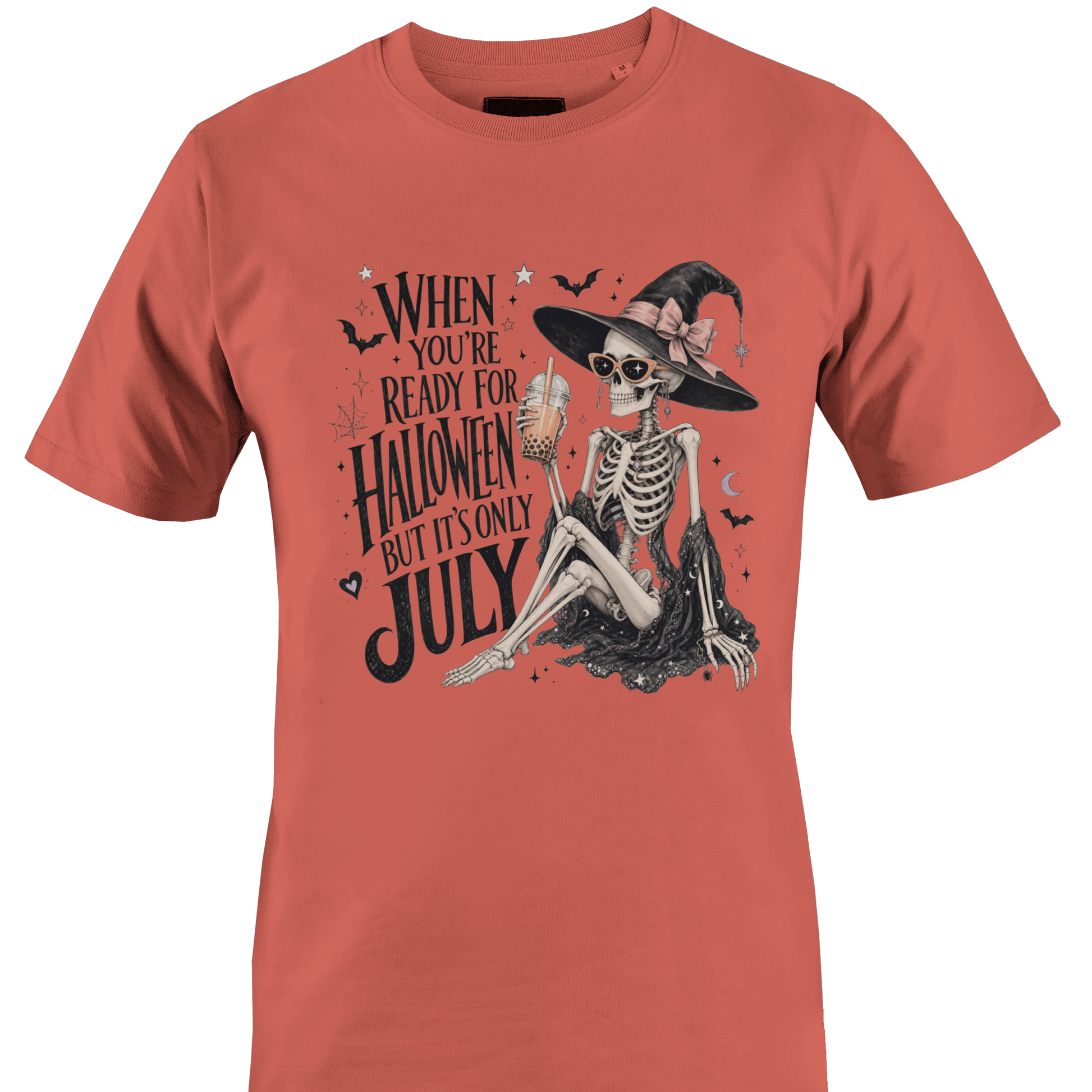 Coral t-shirt with skeleton witch design and text "when you're ready for Halloween but it's only July" by Monkey's Creations. 