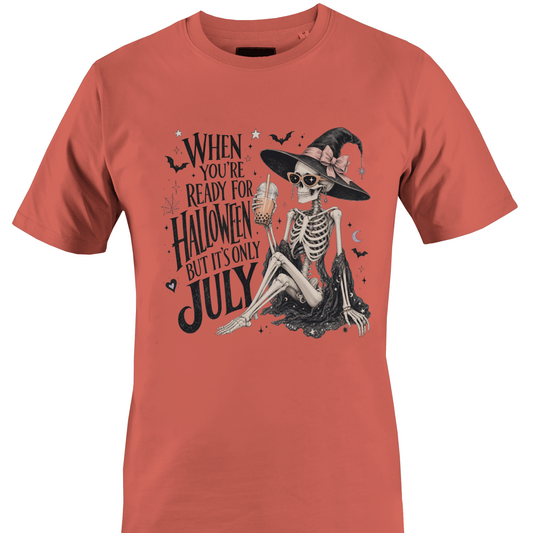 Coral t-shirt with skeleton witch design and text "when you're ready for Halloween but it's only July" by Monkey's Creations. 