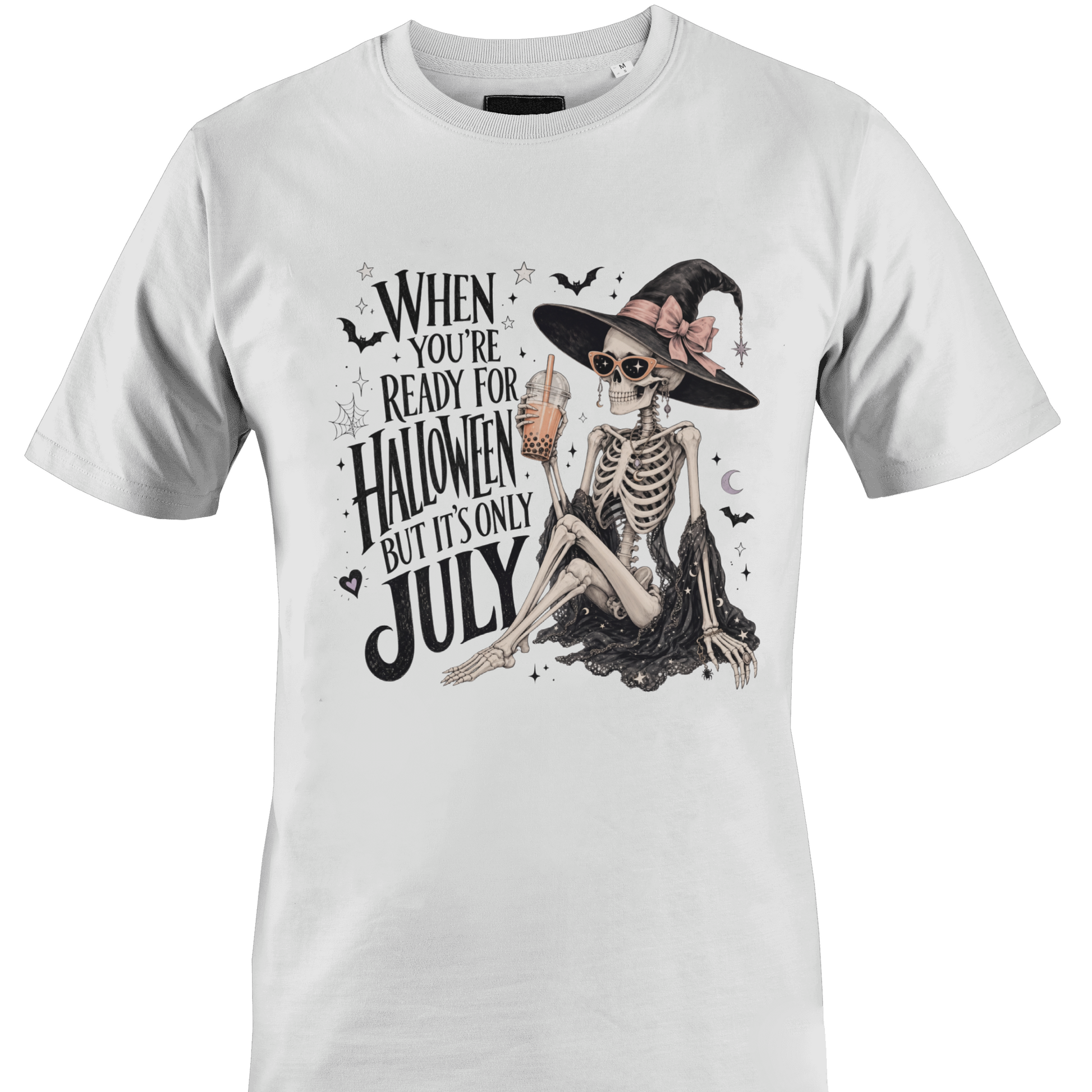 White t-shirt with skeleton witch design and text "when you're ready for Halloween but it's only July" by Monkey's Creations. 