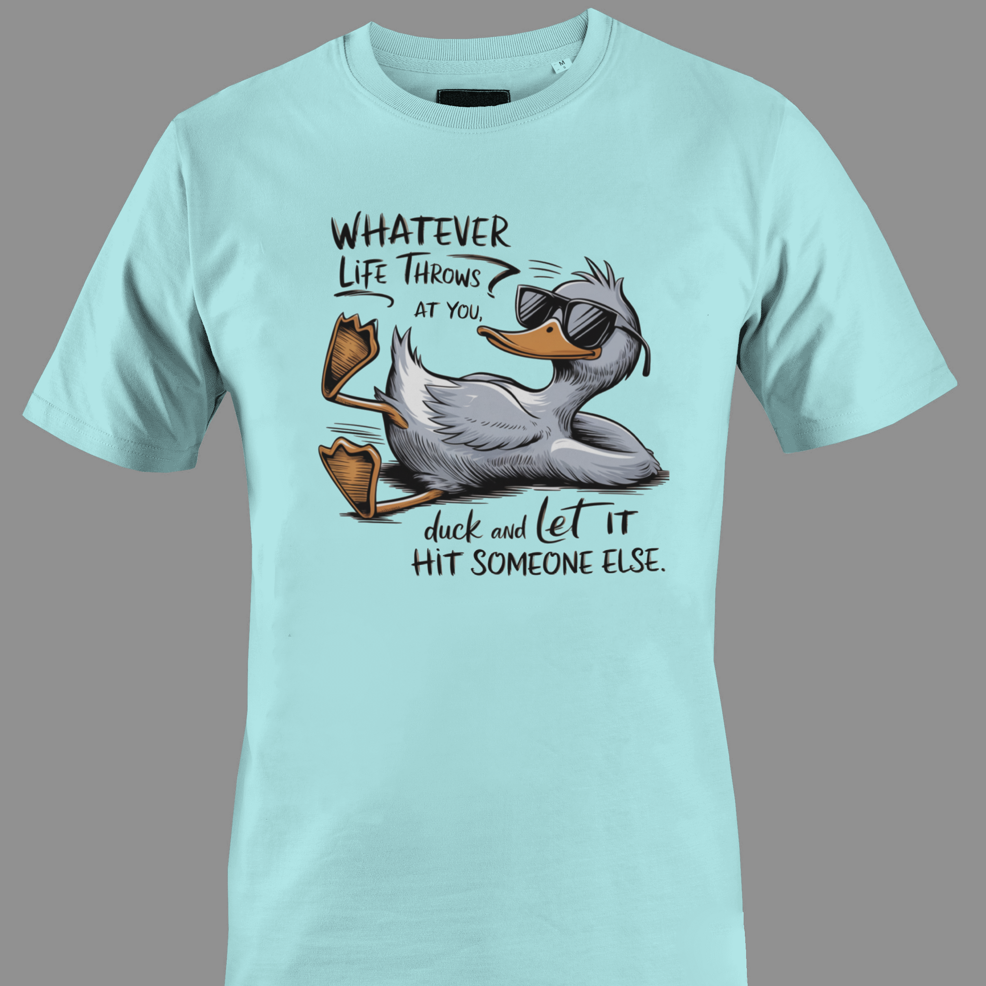 Light blue t-shirt with a cartoon duck graphic and text whatever life throws at you