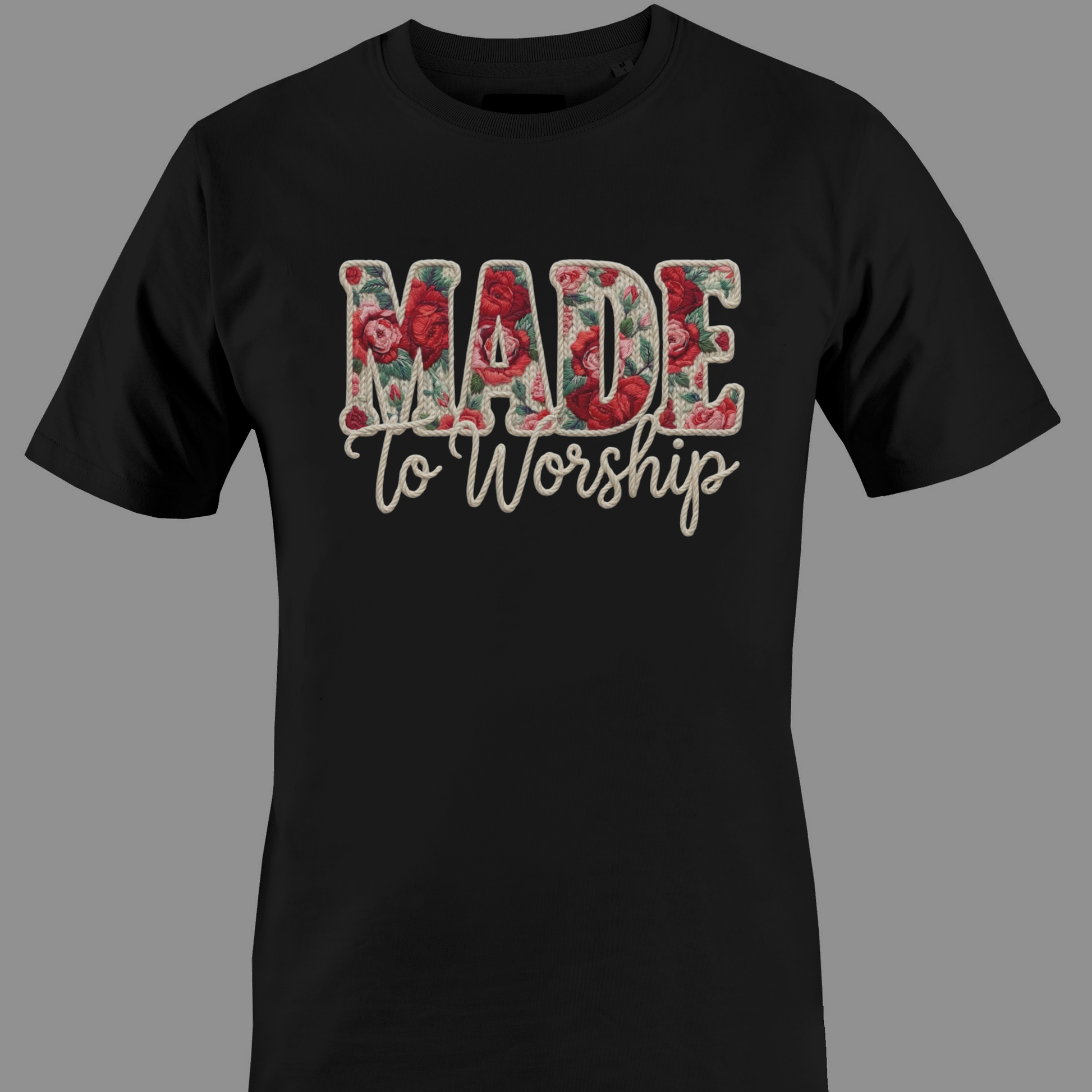 Black t-shirt with 'Made to Worship' text in a floral design 