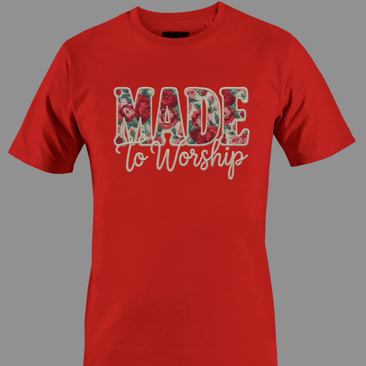 Red t-shirt with 'Made to Worship' text in a floral design 