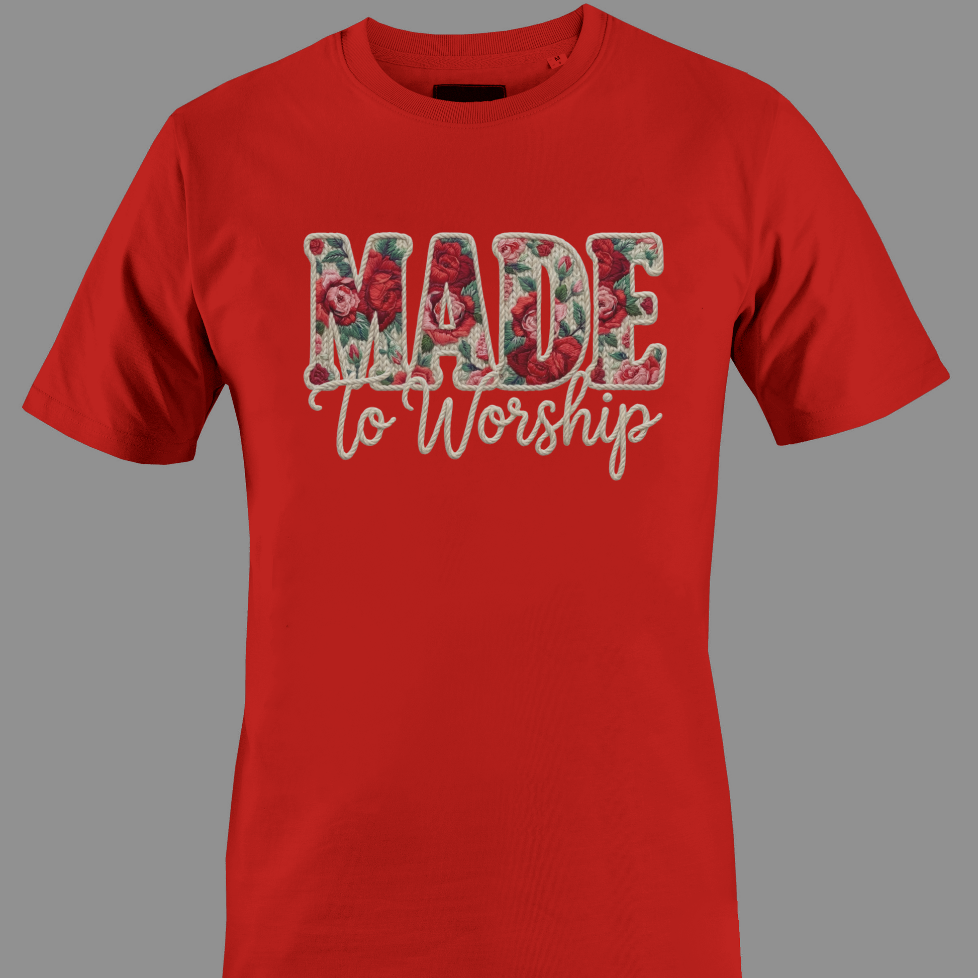 Red t-shirt with 'Made to Worship' text in a floral design 