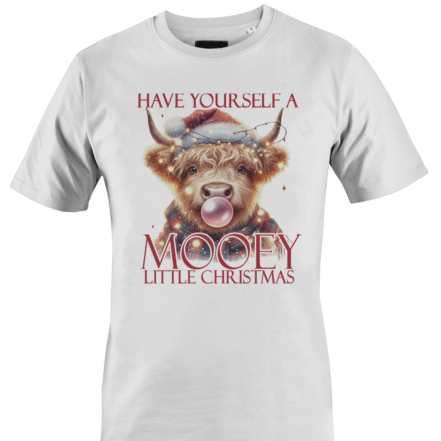 White t-shirt with a cow in a Santa hat and the text "have yourself a mooey little Christmas" by Monkey's Creations.