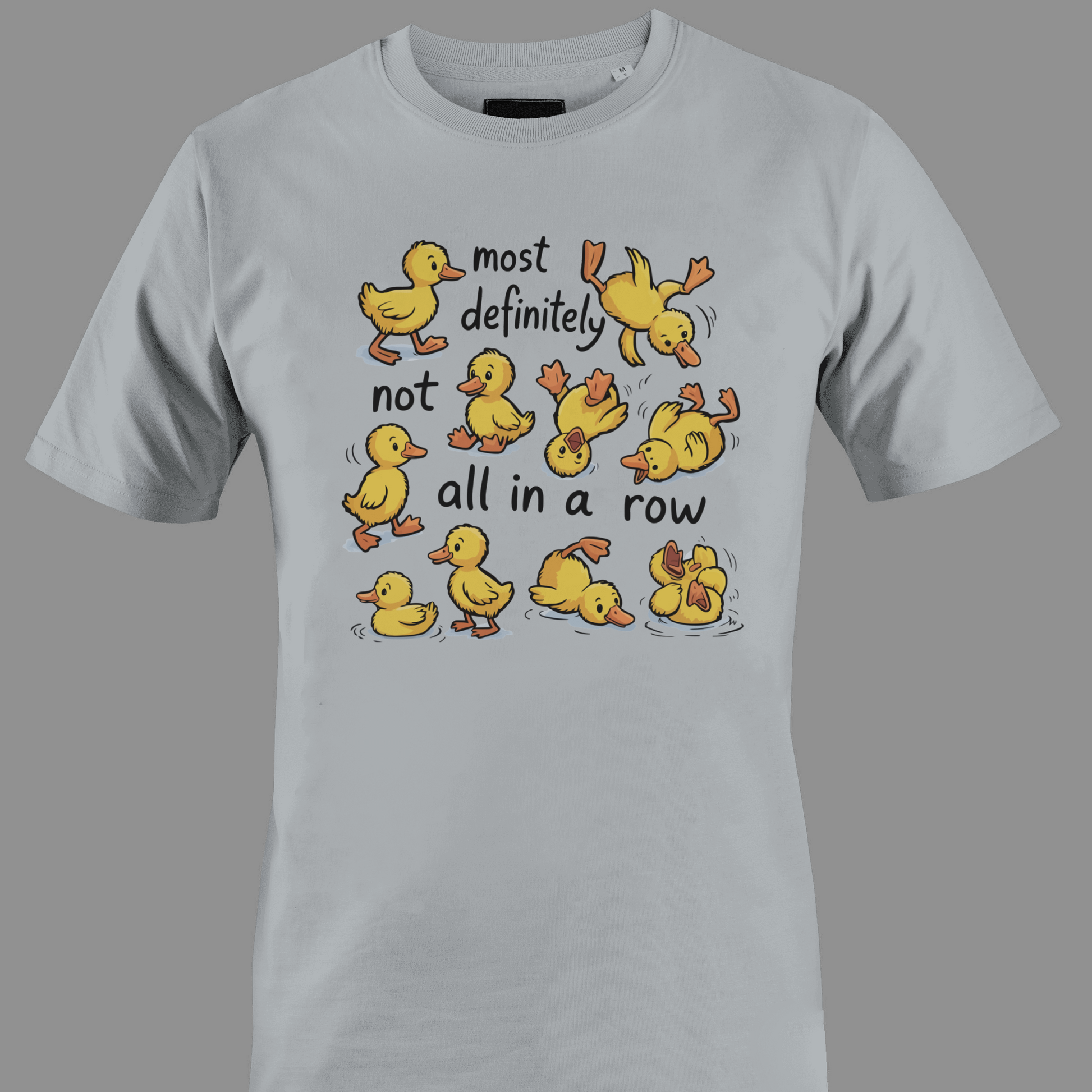 Light gray t-shirt with yellow ducklings and text most definitely not all in a row