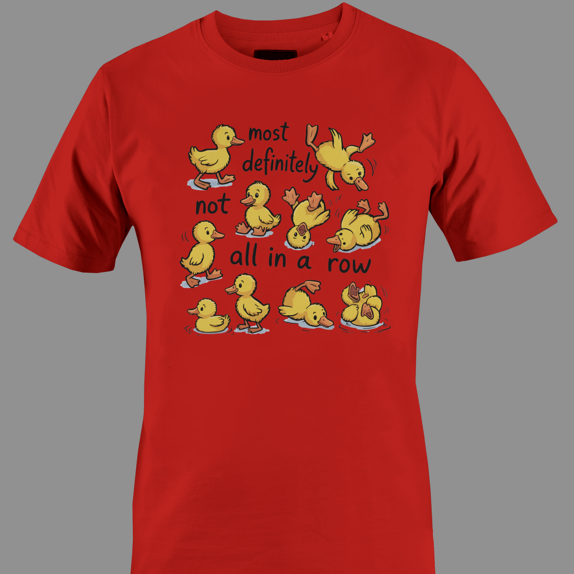 Red t-shirt with yellow ducklings and text most definitely not all in a row