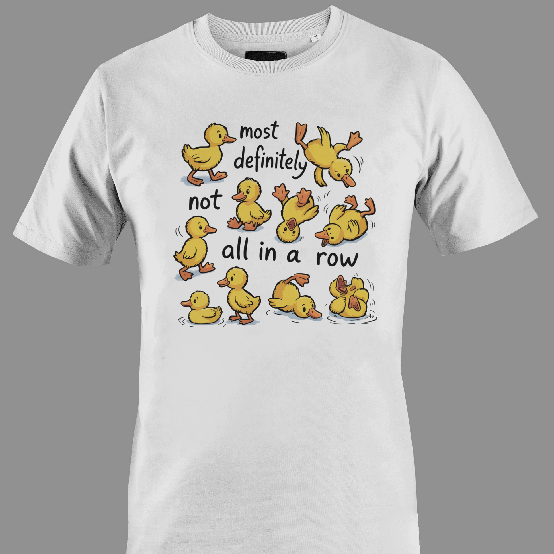 White t-shirt with yellow ducklings and text most definitely not all in a row