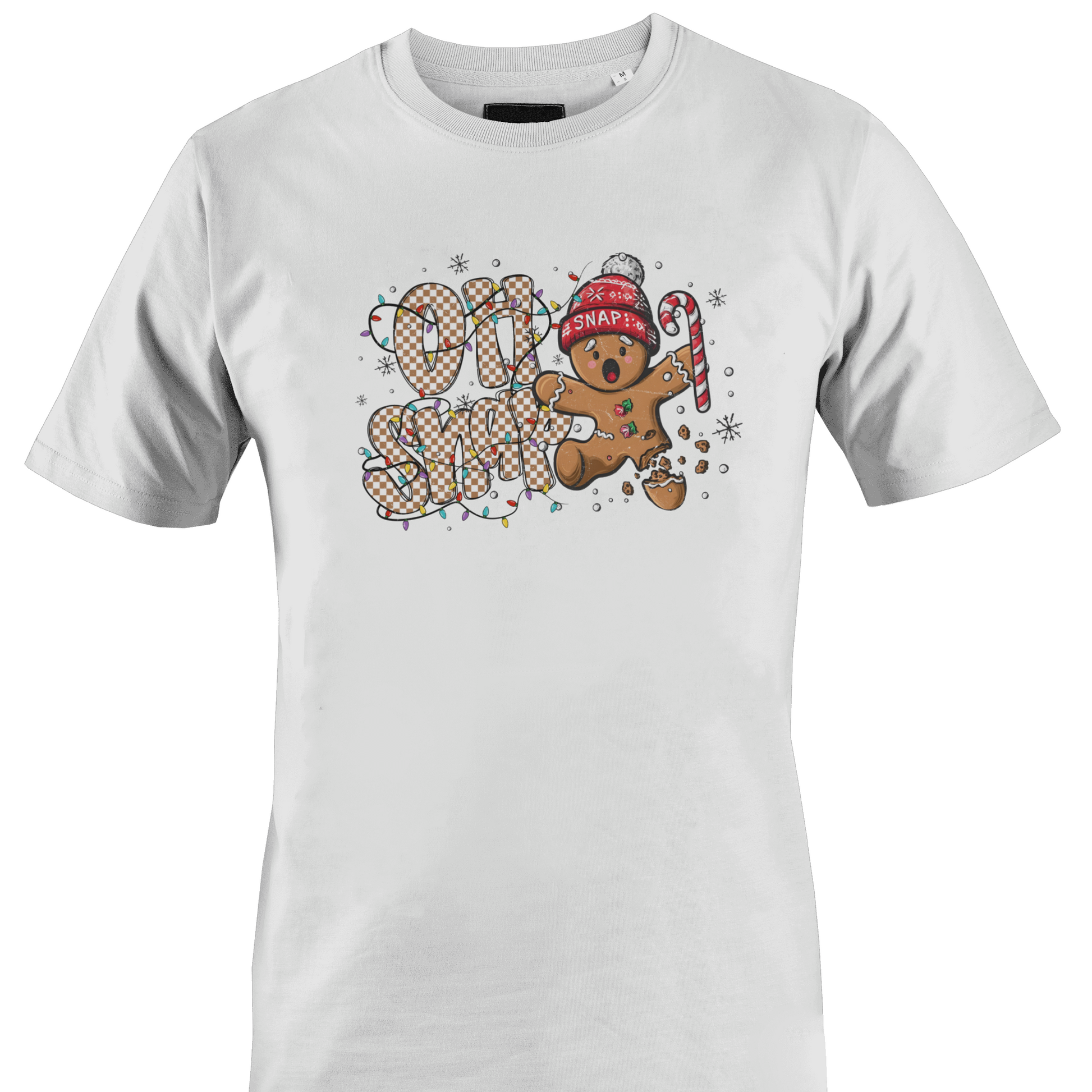 A white short-sleeve crewneck t-shirt featuring a festive graphic on the chest with the text 'OH SNAP' in a patterned font, a gingerbread man wearing a red knit hat and holding a candy cane, and small snowflake details by Monkey's Creations.