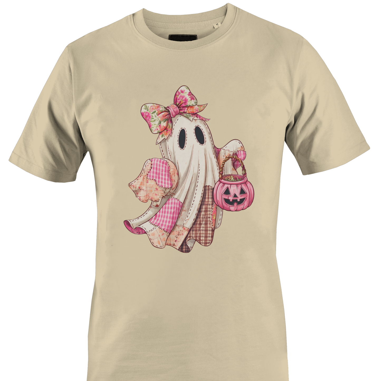 Tan t-shirt with a pink themed patchwork ghost wearing a bow carrying a jack o lantern candy bin by Monkey's Creations. 