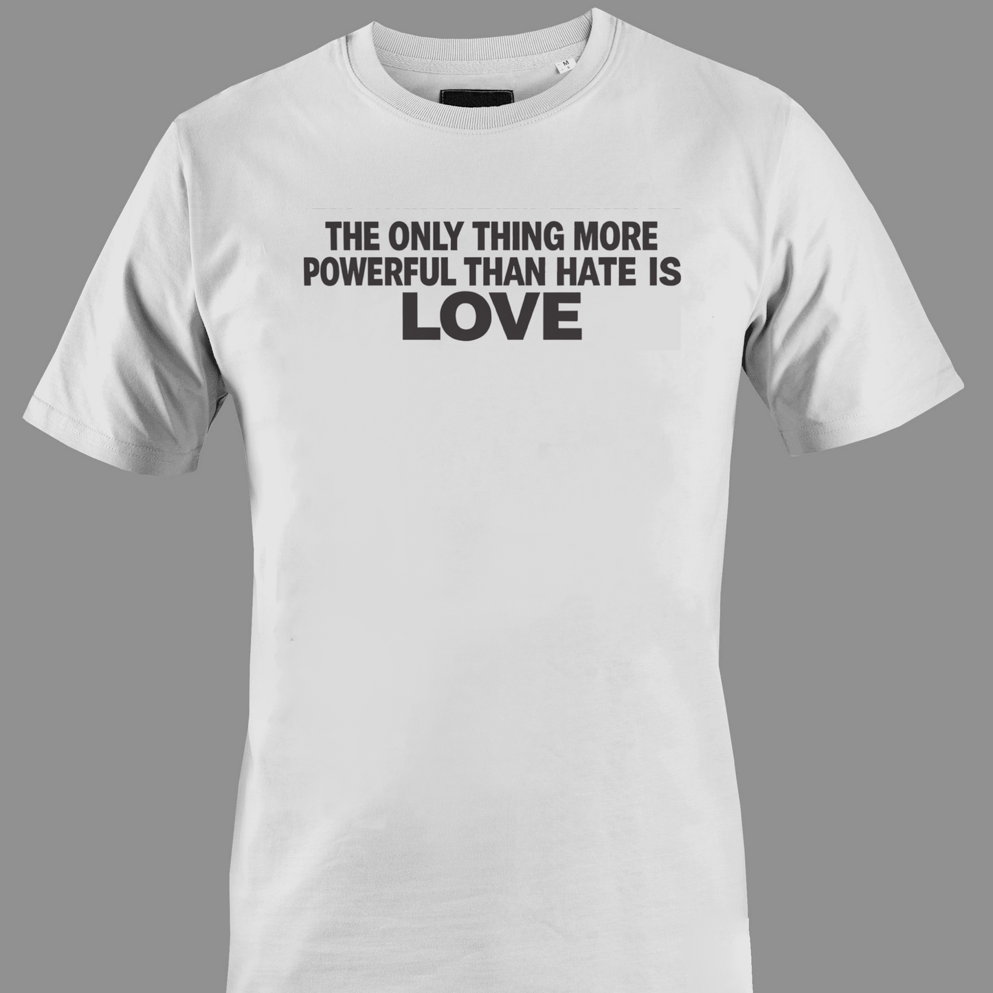 White t-shirt with text the only thing more powerful than love is hate 