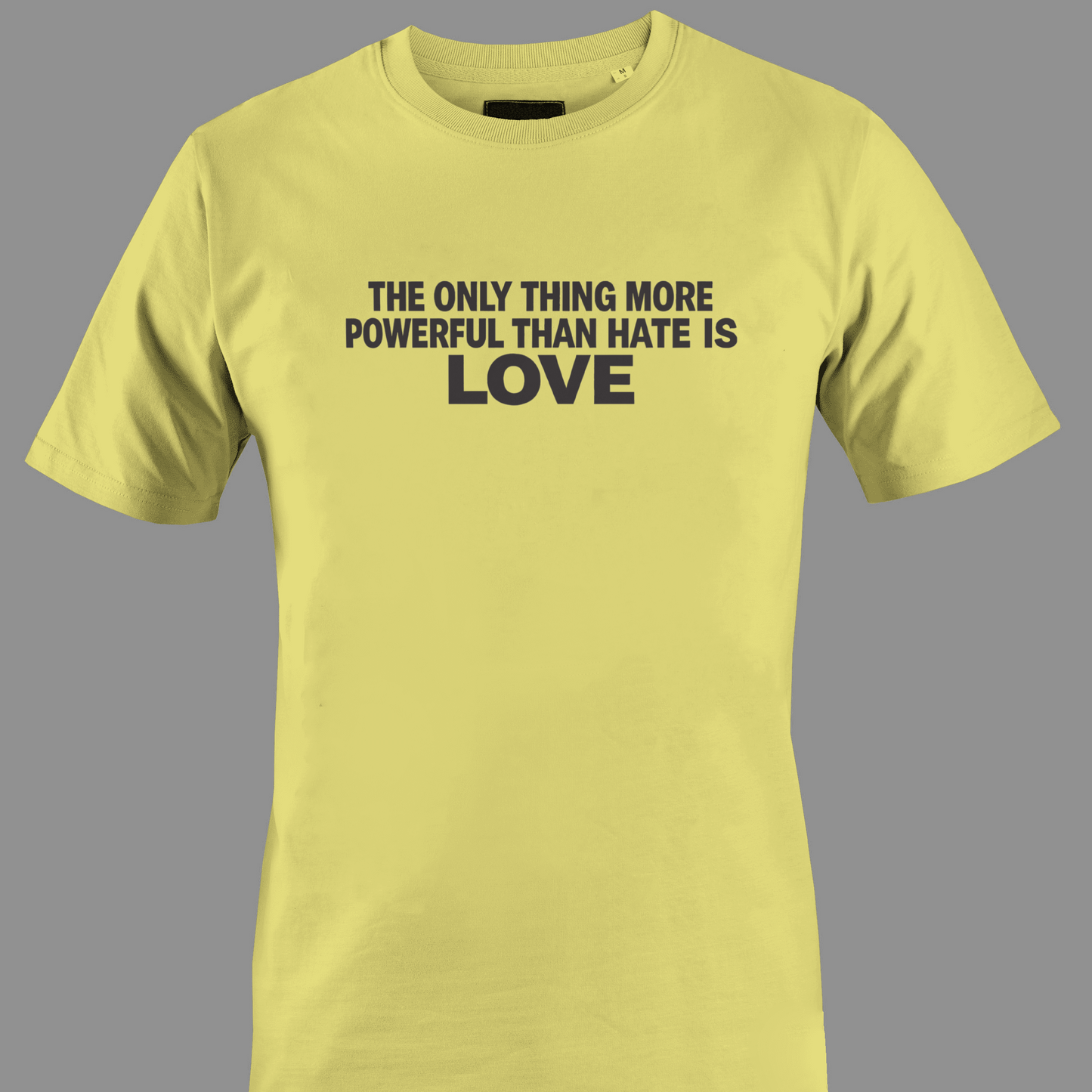 Yellow t-shirt with text the only thing more powerful than love is hate 