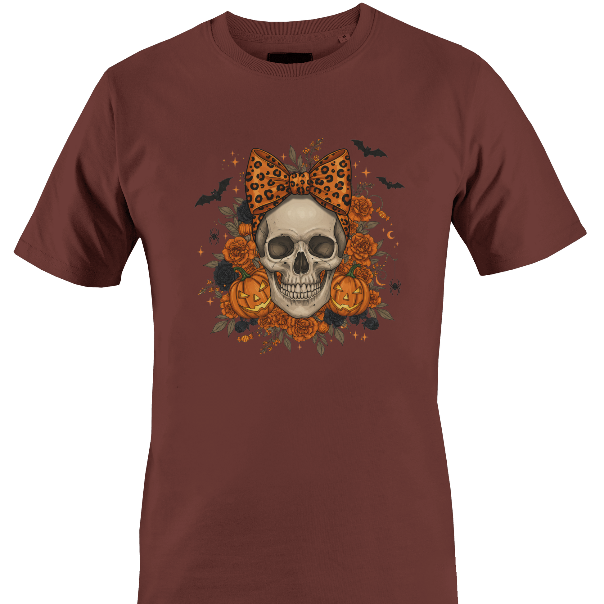 Brown t-shirt with a skull wearing an orange leopard print bow surrounded by black and orange roses and jack o lanterns for Halloween by Monkey's Creations. 
