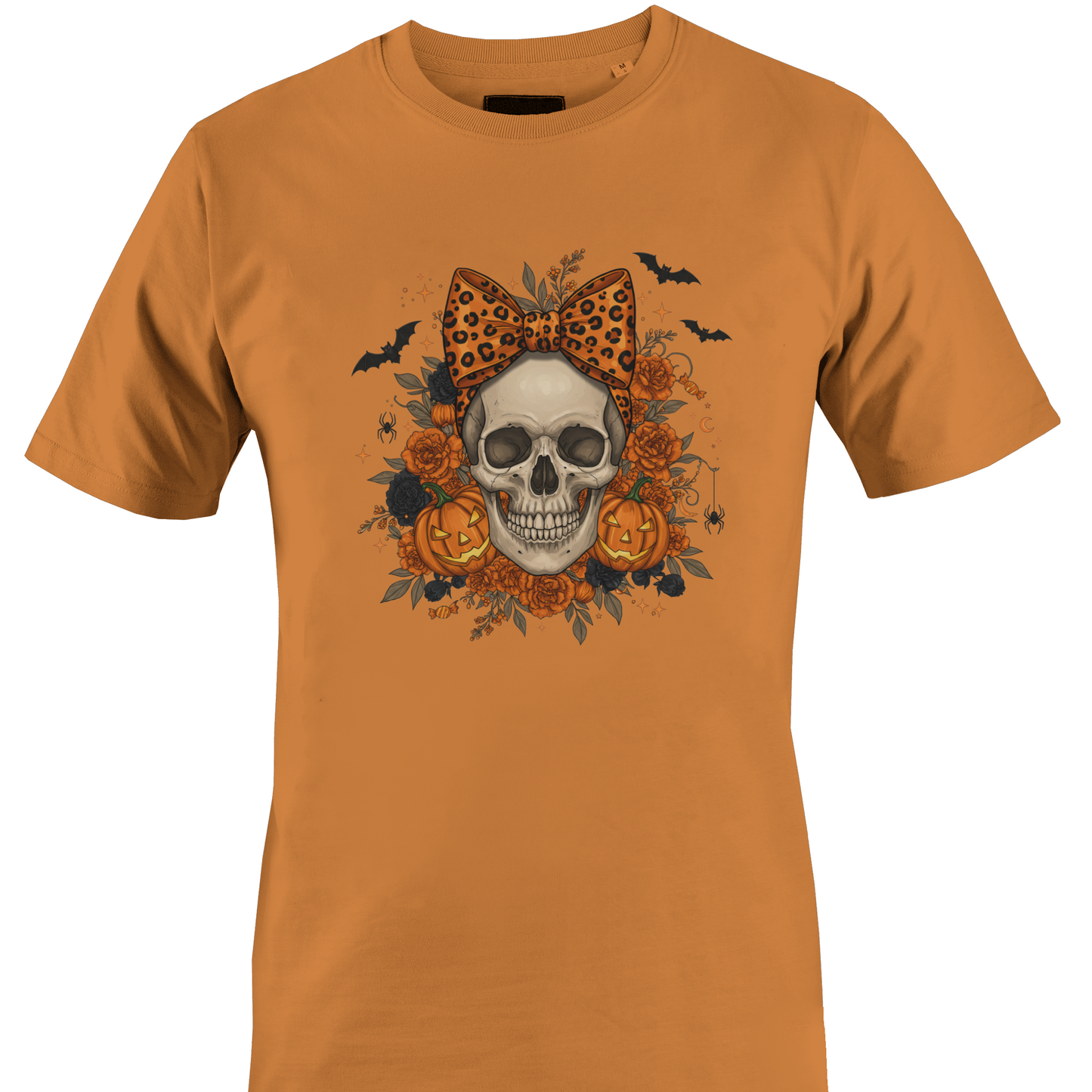 Orange t-shirt with a skull wearing an orange leopard print bow surrounded by black and orange roses and jack o lanterns for Halloween by Monkey's Creations. 