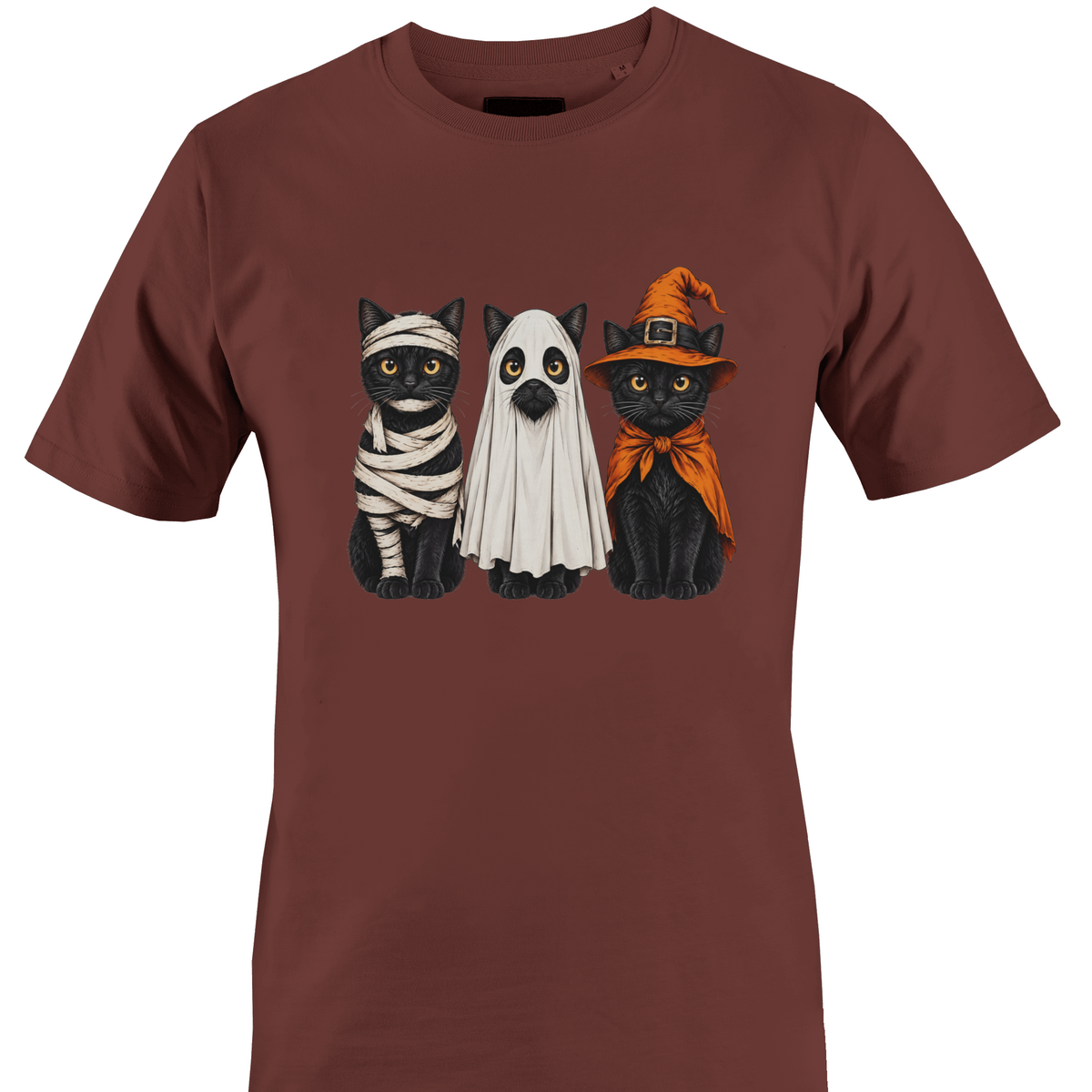 A brown short-sleeve crewneck t-shirt featuring a graphic print of three black cats dressed in Halloween costumes (as a mummy, a ghost, and as a witch) by Monkey's Creations.