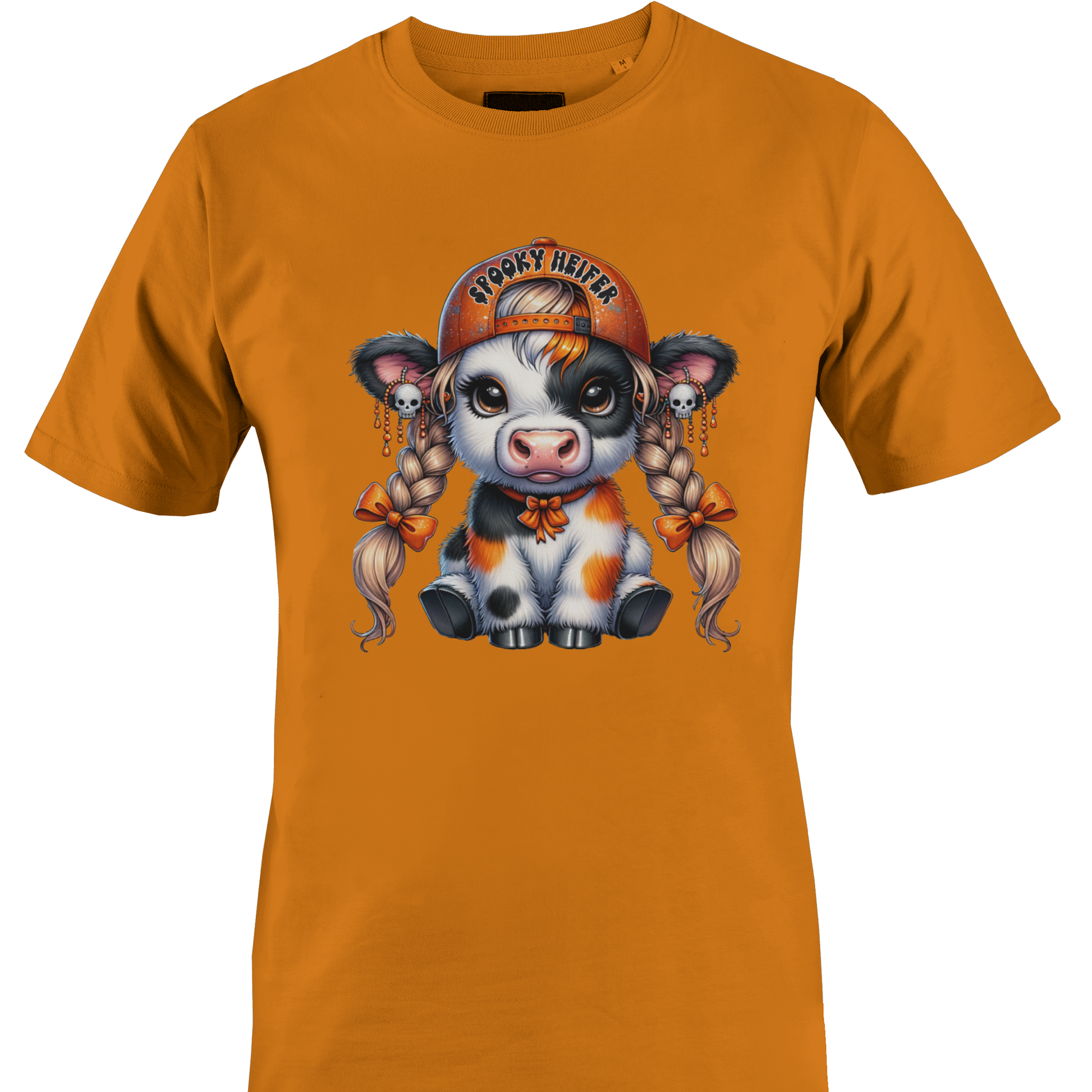 An orange short-sleeve crewneck t-shirt featuring a colorful graphic of a cute cartoon cow wearing an orange baseball cap with the text 'spooky heifer' by Monkey's Creations.